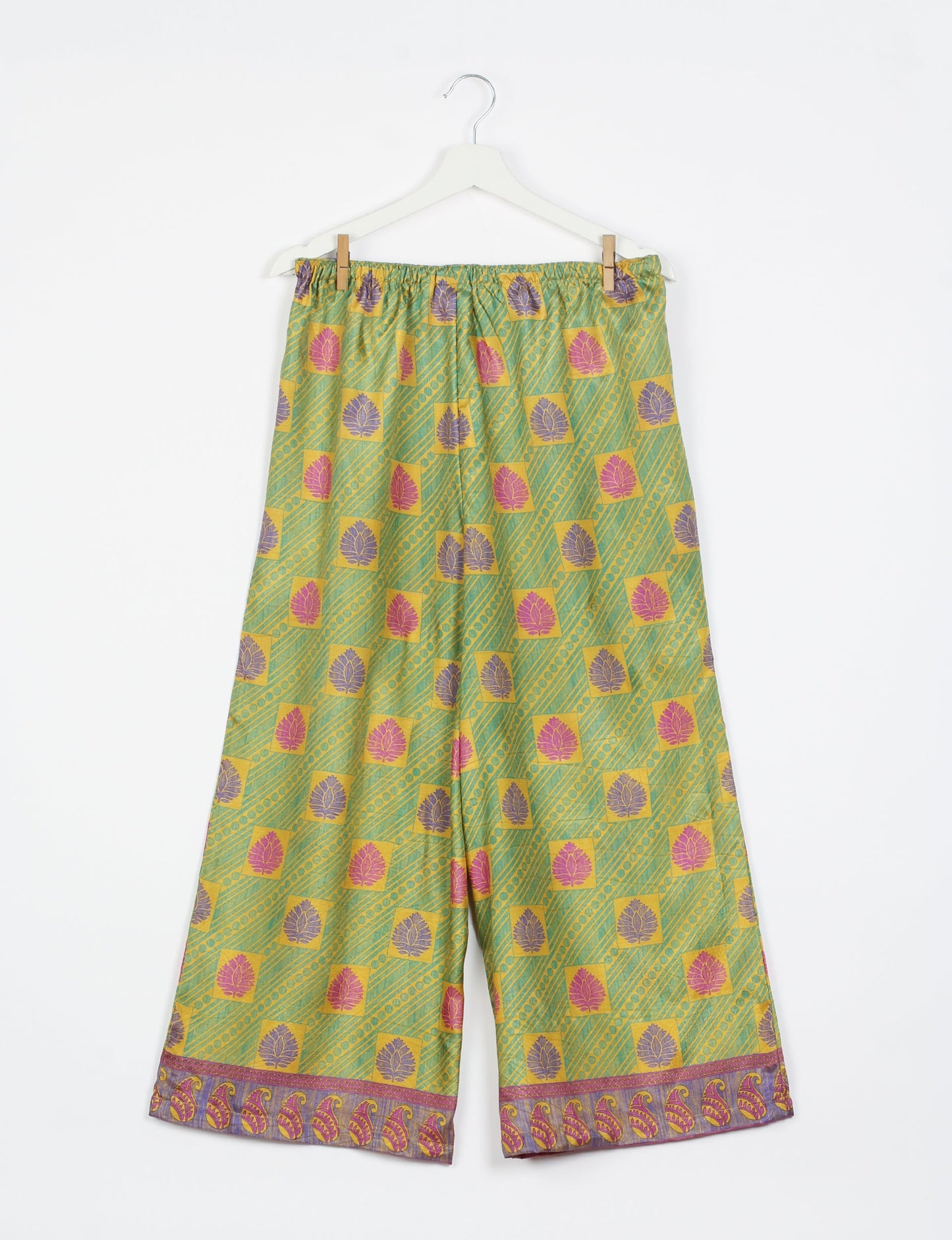 Step into sustainable fashion with our Palazzo Pants – a harmonious blend of Indian and Italian influences. These wide-legged pants, made from upcycled saris, offer comfort with an all-around elastic waist and a stylish flared leg. Make a statement with eco-friendly, chic palazzo pants that redefine ethical clothing.