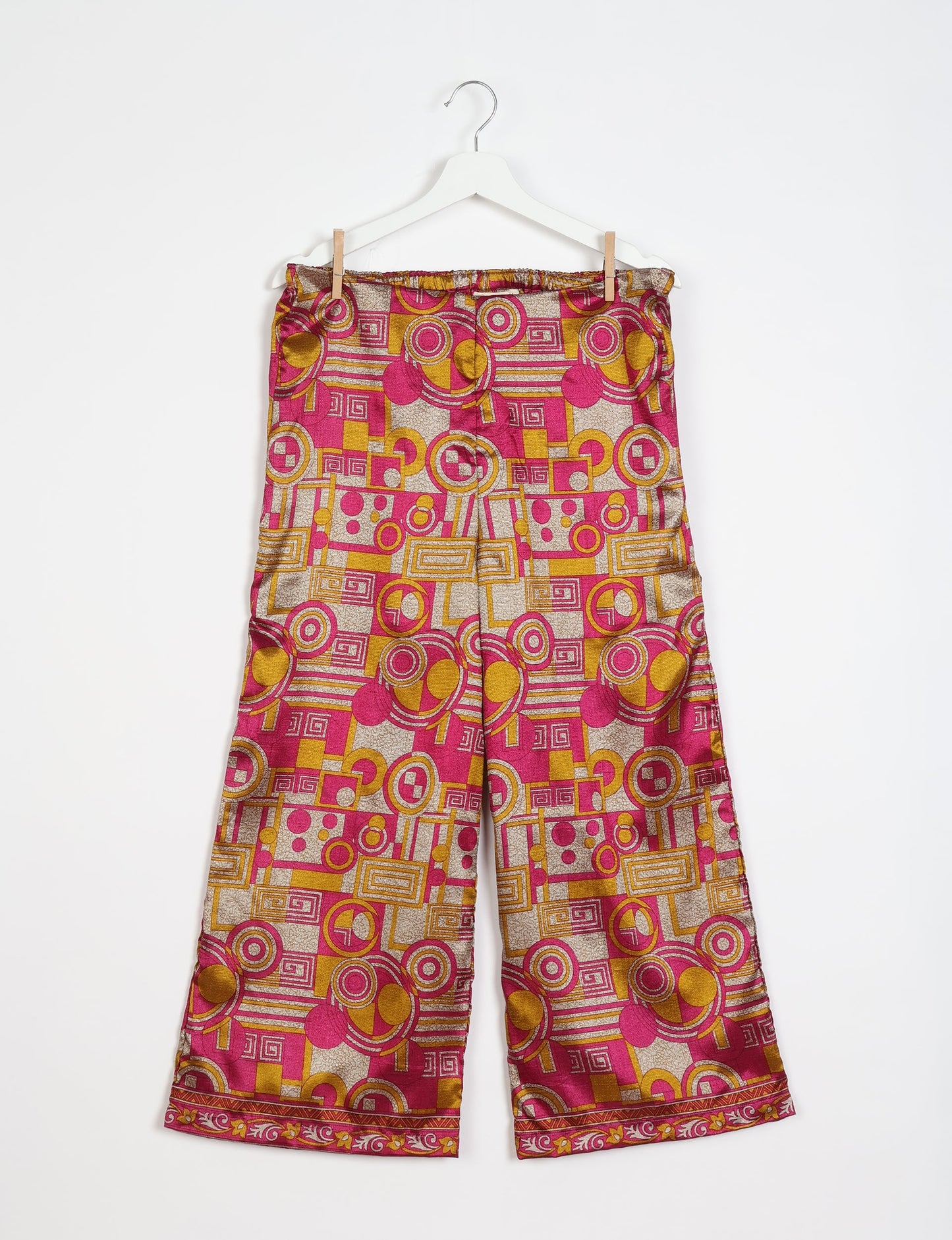 Step into sustainable fashion with our Palazzo Pants – a harmonious blend of Indian and Italian influences. These wide-legged pants, made from upcycled saris, offer comfort with an all-around elastic waist and a stylish flared leg. Make a statement with eco-friendly, chic palazzo pants that redefine ethical clothing.