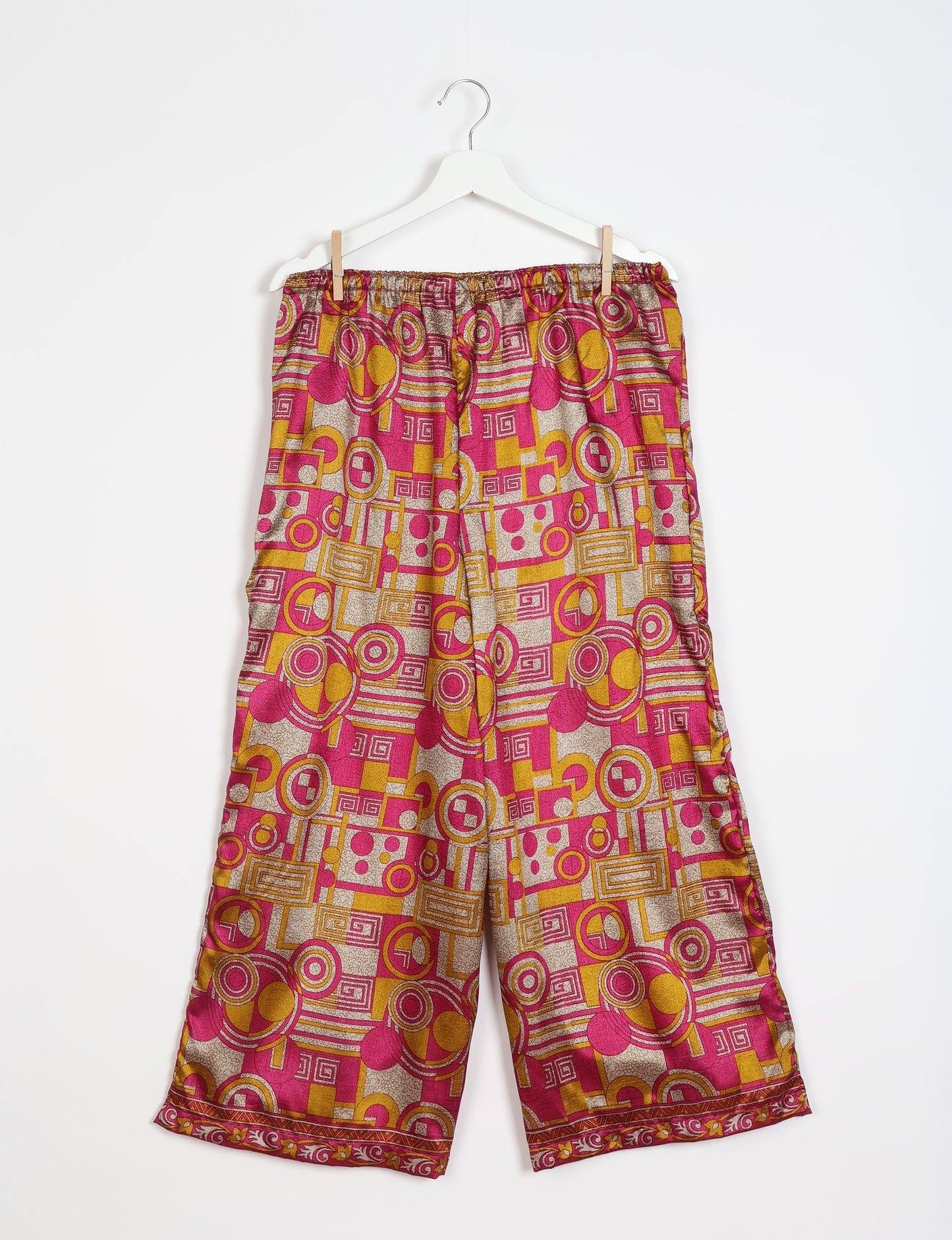 Step into sustainable fashion with our Palazzo Pants – a harmonious blend of Indian and Italian influences. These wide-legged pants, made from upcycled saris, offer comfort with an all-around elastic waist and a stylish flared leg. Make a statement with eco-friendly, chic palazzo pants that redefine ethical clothing.