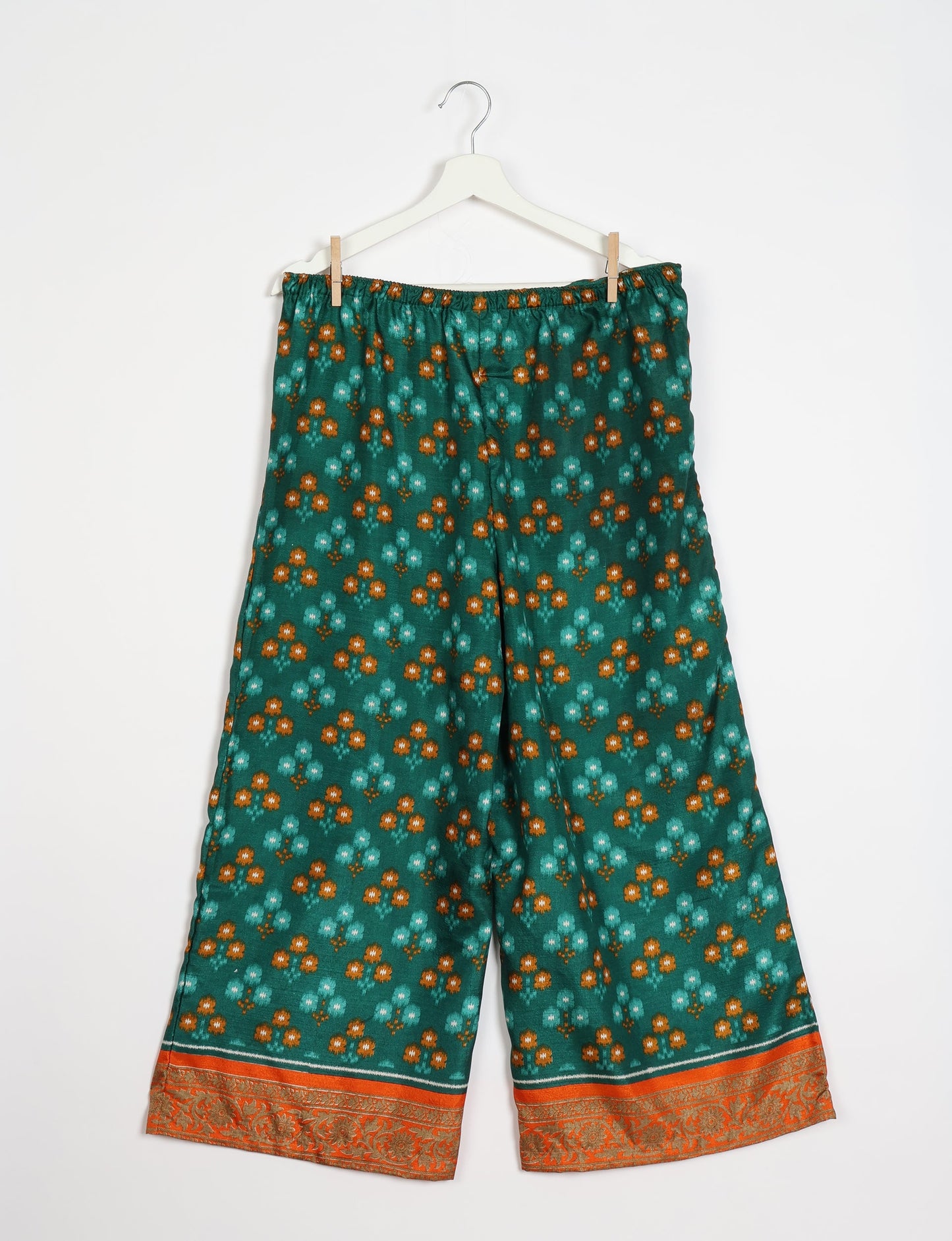 Step into sustainable fashion with our Palazzo Pants – a harmonious blend of Indian and Italian influences. These wide-legged pants, made from upcycled saris, offer comfort with an all-around elastic waist and a stylish flared leg. Make a statement with eco-friendly, chic palazzo pants that redefine ethical clothing.