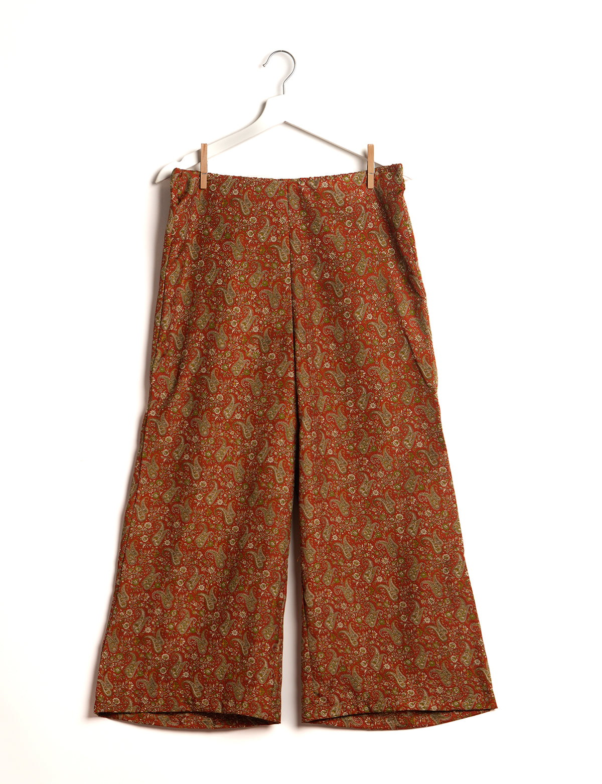 Step into sustainable fashion with our Palazzo Pants – a harmonious blend of Indian and Italian influences. These wide-legged pants, made from upcycled saris, offer comfort with an all-around elastic waist and a stylish flared leg. Make a statement with eco-friendly, chic palazzo pants that redefine ethical clothing.