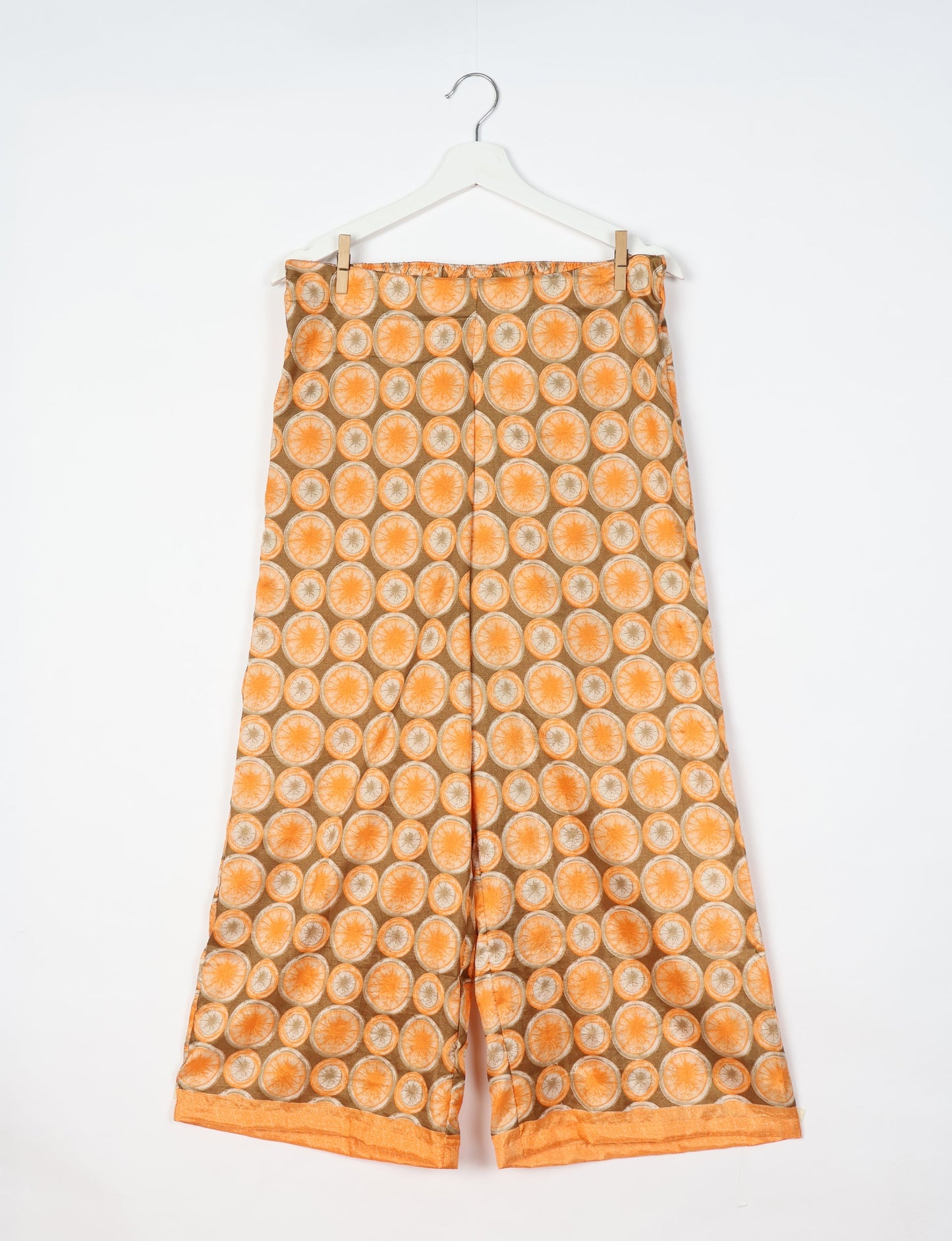 Step into sustainable fashion with our Palazzo Pants – a harmonious blend of Indian and Italian influences. These wide-legged pants, made from upcycled saris, offer comfort with an all-around elastic waist and a stylish flared leg. Make a statement with eco-friendly, chic palazzo pants that redefine ethical clothing.