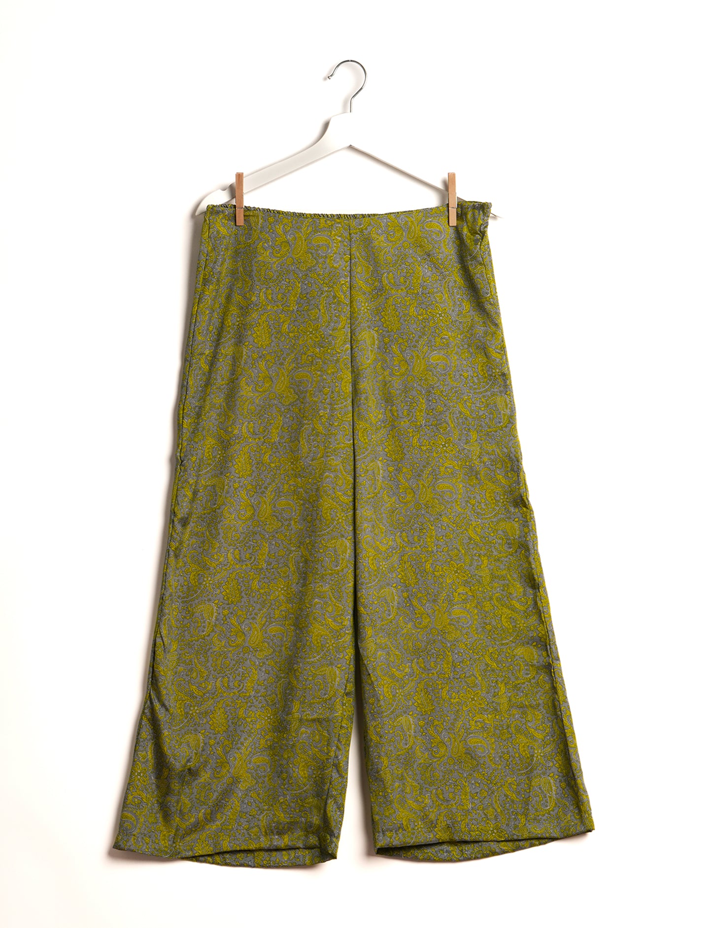 Step into sustainable fashion with our Palazzo Pants – a harmonious blend of Indian and Italian influences. These wide-legged pants, made from upcycled saris, offer comfort with an all-around elastic waist and a stylish flared leg. Make a statement with eco-friendly, chic palazzo pants that redefine ethical clothing.