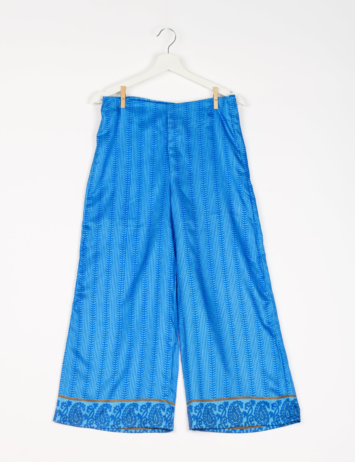 Step into sustainable fashion with our Palazzo Pants – a harmonious blend of Indian and Italian influences. These wide-legged pants, made from upcycled saris, offer comfort with an all-around elastic waist and a stylish flared leg. Make a statement with eco-friendly, chic palazzo pants that redefine ethical clothing.