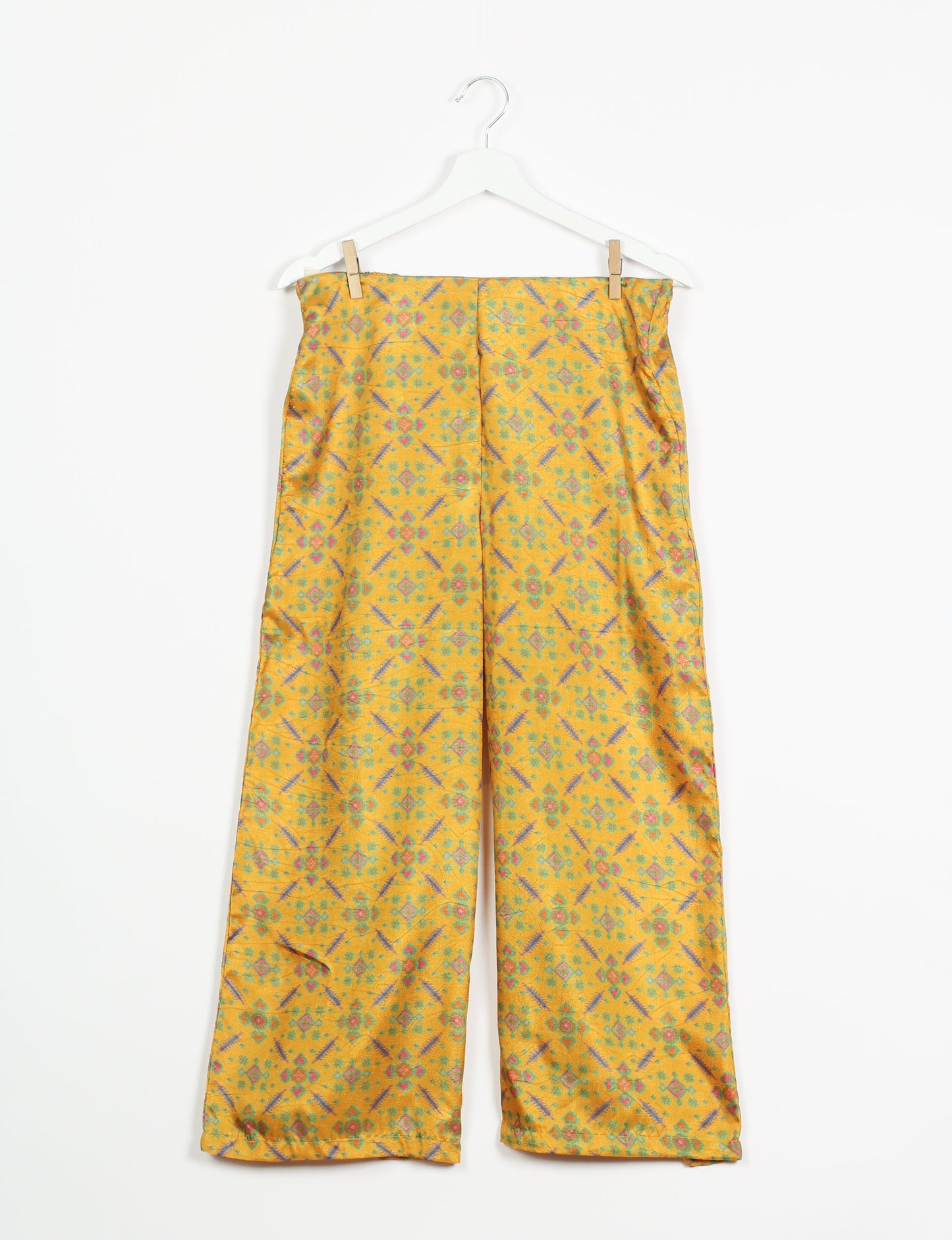 Step into sustainable fashion with our Palazzo Pants – a harmonious blend of Indian and Italian influences. These wide-legged pants, made from upcycled saris, offer comfort with an all-around elastic waist and a stylish flared leg. Make a statement with eco-friendly, chic palazzo pants that redefine ethical clothing.