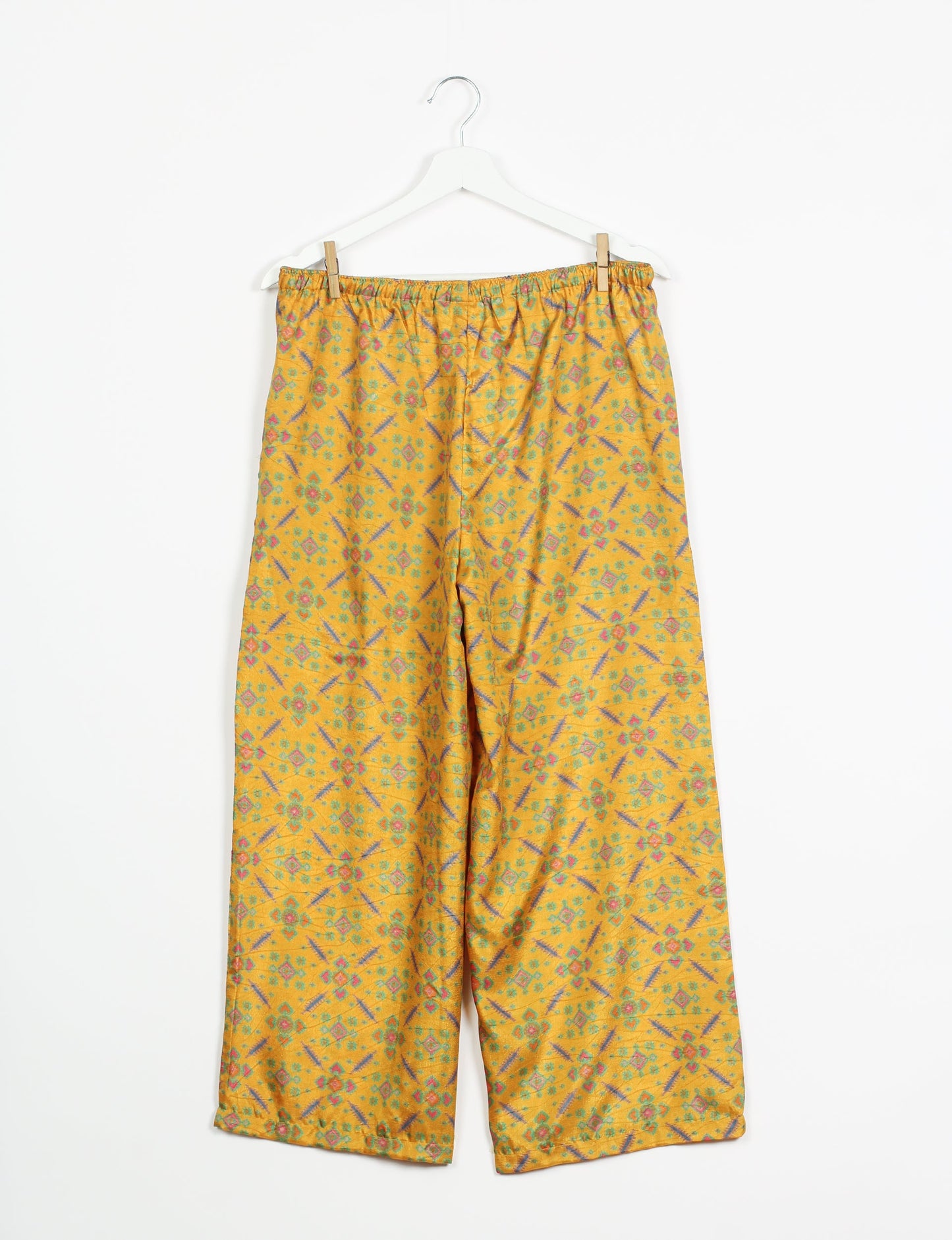 Step into sustainable fashion with our Palazzo Pants – a harmonious blend of Indian and Italian influences. These wide-legged pants, made from upcycled saris, offer comfort with an all-around elastic waist and a stylish flared leg. Make a statement with eco-friendly, chic palazzo pants that redefine ethical clothing.