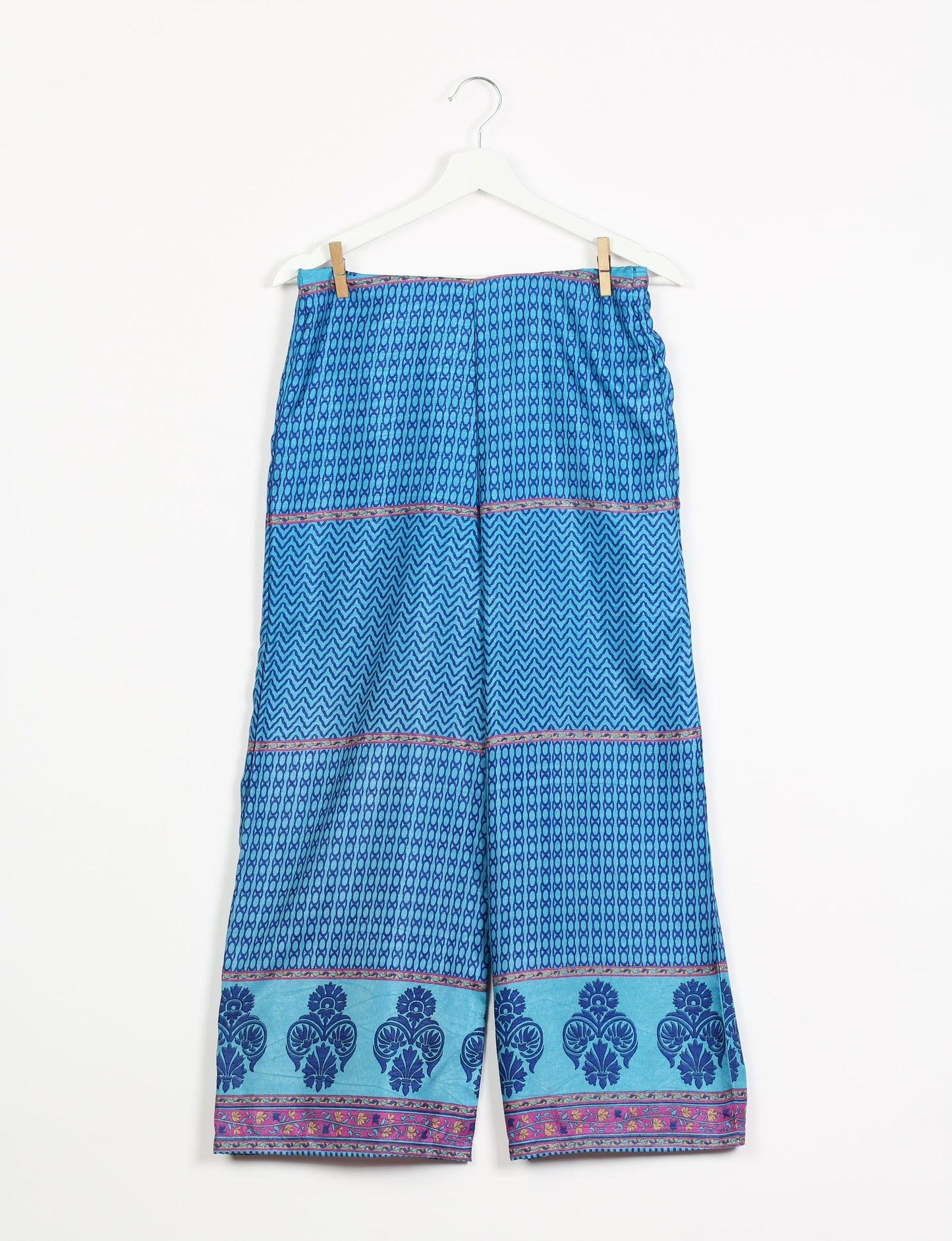 Step into sustainable fashion with our Palazzo Pants – a harmonious blend of Indian and Italian influences. These wide-legged pants, made from upcycled saris, offer comfort with an all-around elastic waist and a stylish flared leg. Make a statement with eco-friendly, chic palazzo pants that redefine ethical clothing.