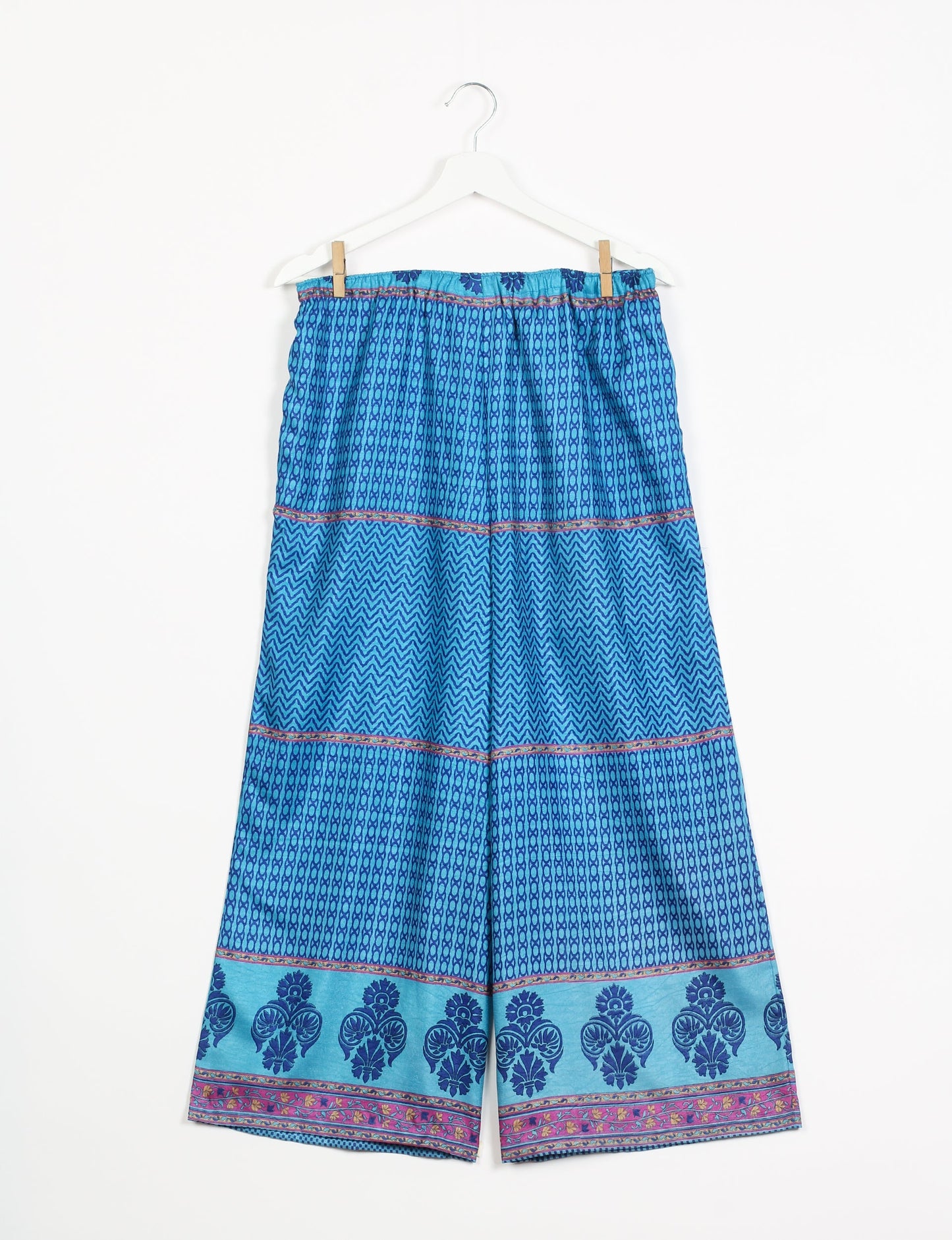 Step into sustainable fashion with our Palazzo Pants – a harmonious blend of Indian and Italian influences. These wide-legged pants, made from upcycled saris, offer comfort with an all-around elastic waist and a stylish flared leg. Make a statement with eco-friendly, chic palazzo pants that redefine ethical clothing.