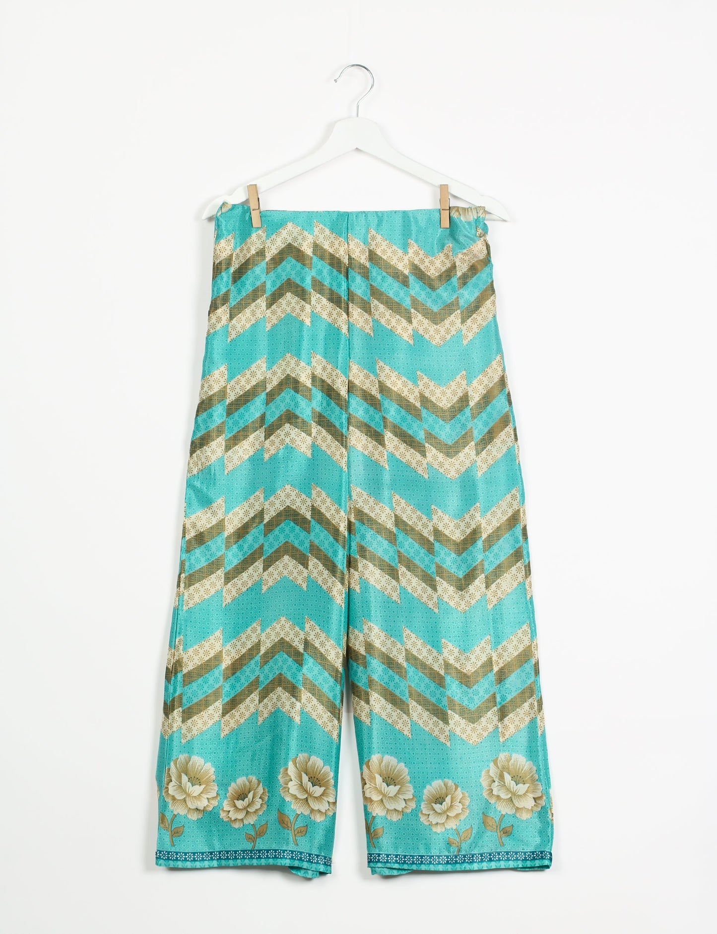 Step into sustainable fashion with our Palazzo Pants – a harmonious blend of Indian and Italian influences. These wide-legged pants, made from upcycled saris, offer comfort with an all-around elastic waist and a stylish flared leg. Make a statement with eco-friendly, chic palazzo pants that redefine ethical clothing.