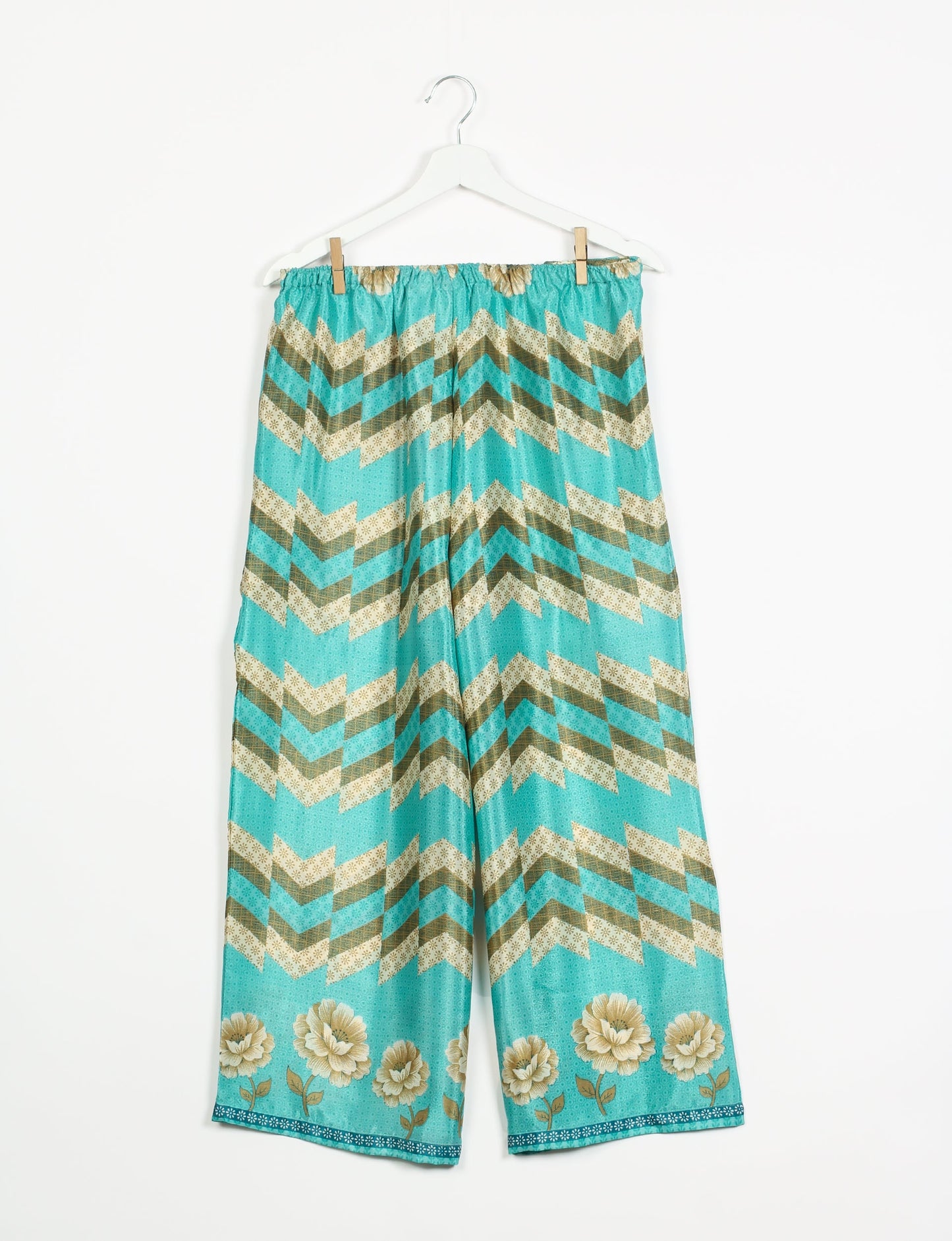 Step into sustainable fashion with our Palazzo Pants – a harmonious blend of Indian and Italian influences. These wide-legged pants, made from upcycled saris, offer comfort with an all-around elastic waist and a stylish flared leg. Make a statement with eco-friendly, chic palazzo pants that redefine ethical clothing.