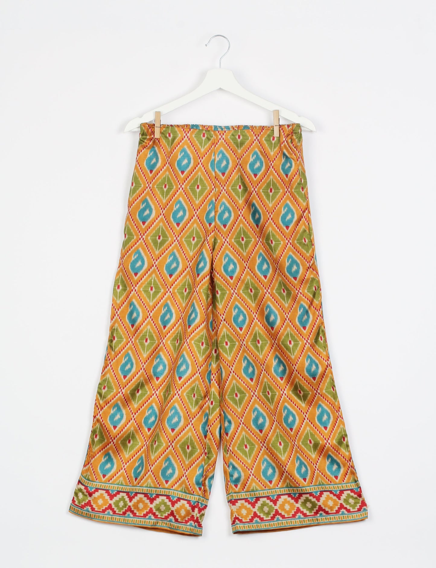 Step into sustainable fashion with our Palazzo Pants – a harmonious blend of Indian and Italian influences. These wide-legged pants, made from upcycled saris, offer comfort with an all-around elastic waist and a stylish flared leg. Make a statement with eco-friendly, chic palazzo pants that redefine ethical clothing.