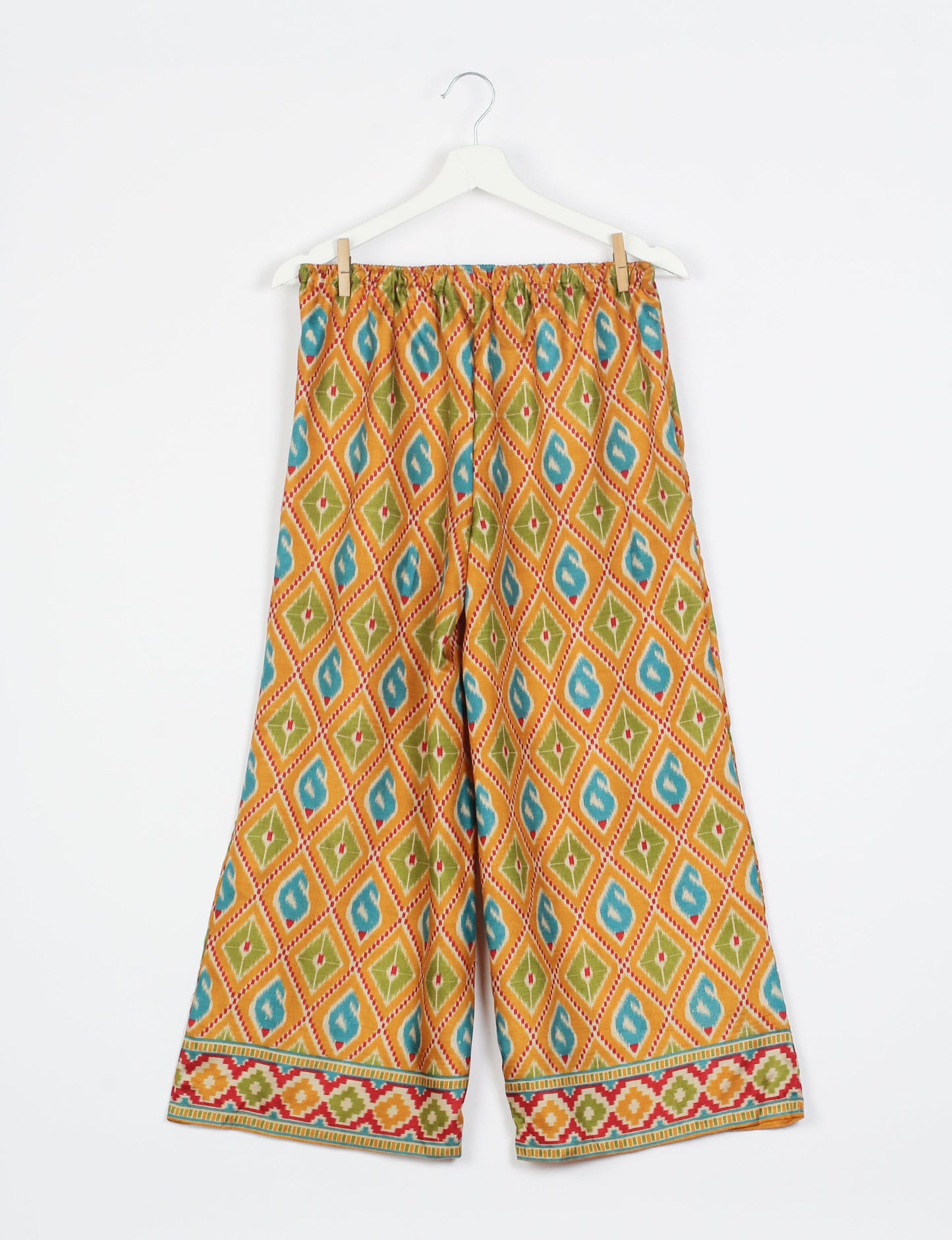 Step into sustainable fashion with our Palazzo Pants – a harmonious blend of Indian and Italian influences. These wide-legged pants, made from upcycled saris, offer comfort with an all-around elastic waist and a stylish flared leg. Make a statement with eco-friendly, chic palazzo pants that redefine ethical clothing.