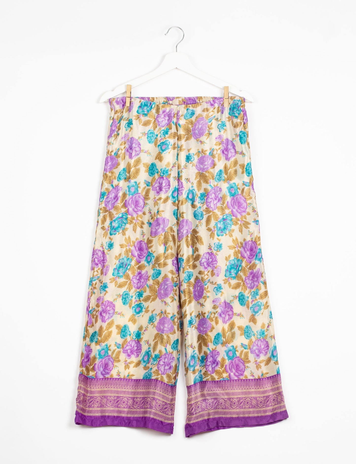 Step into sustainable fashion with our Palazzo Pants – a harmonious blend of Indian and Italian influences. These wide-legged pants, made from upcycled saris, offer comfort with an all-around elastic waist and a stylish flared leg. Make a statement with eco-friendly, chic palazzo pants that redefine ethical clothing.