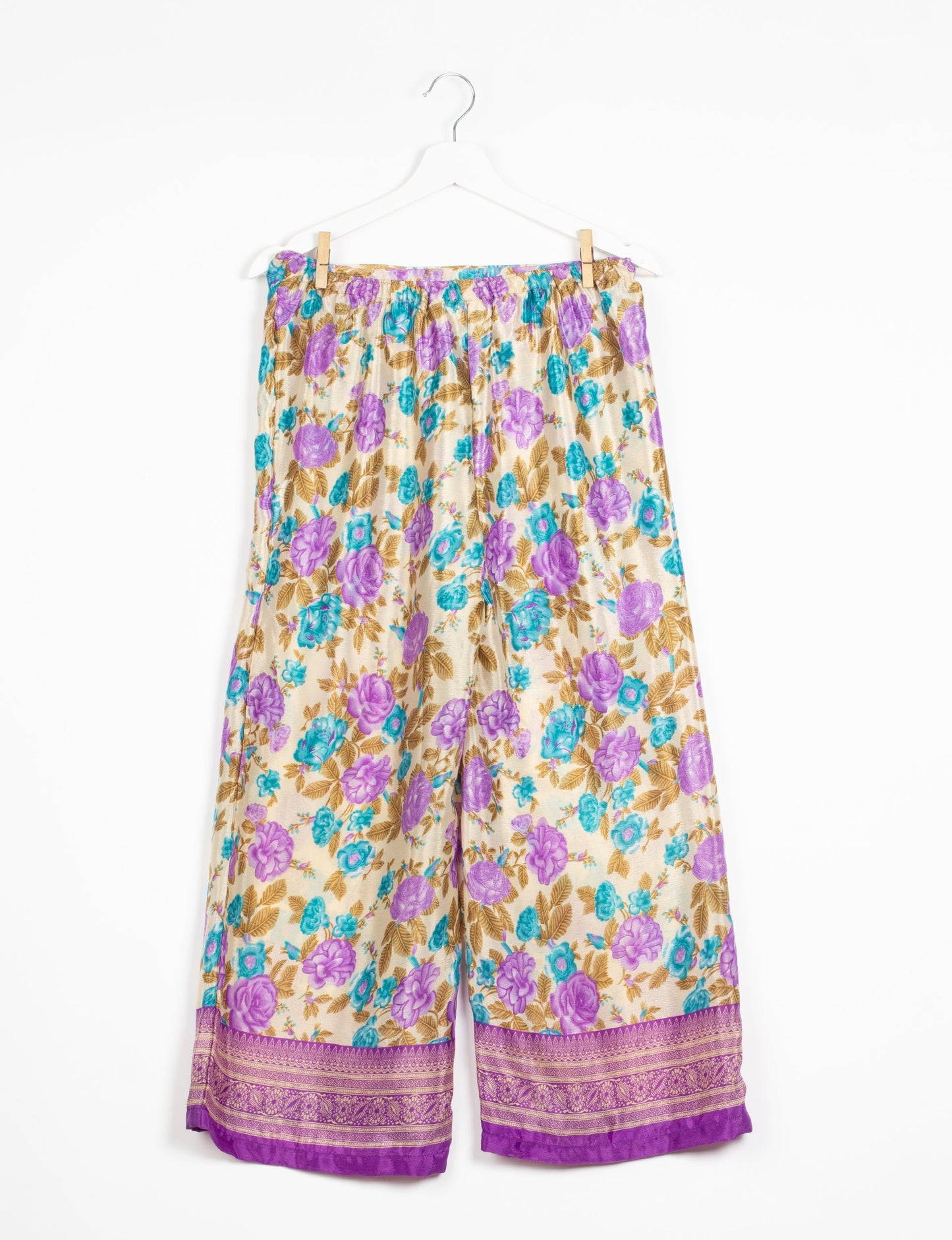 Step into sustainable fashion with our Palazzo Pants – a harmonious blend of Indian and Italian influences. These wide-legged pants, made from upcycled saris, offer comfort with an all-around elastic waist and a stylish flared leg. Make a statement with eco-friendly, chic palazzo pants that redefine ethical clothing.