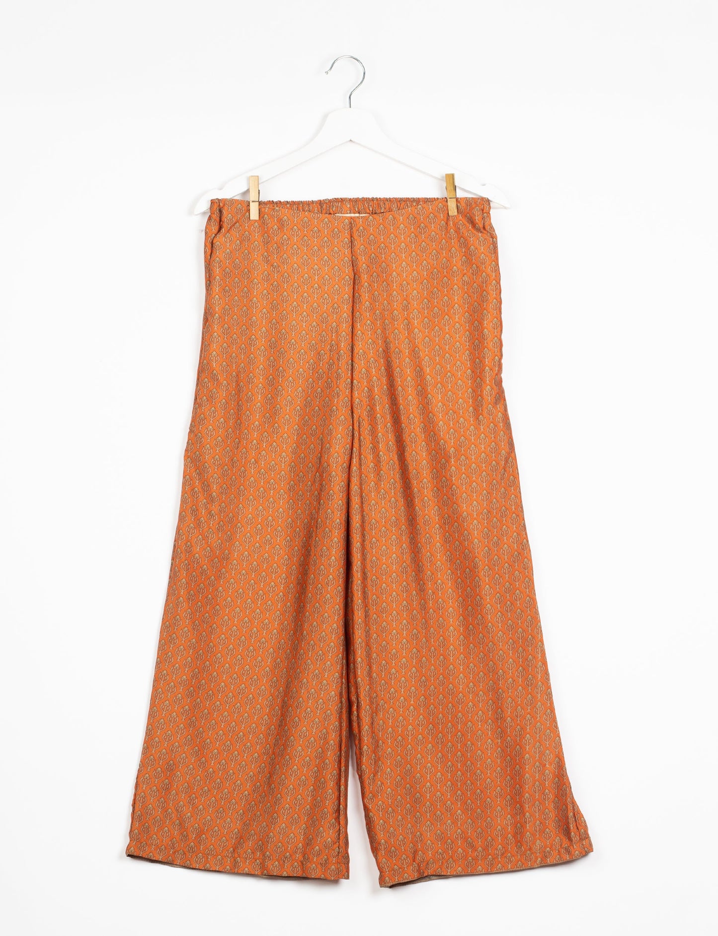 Step into sustainable fashion with our Palazzo Pants – a harmonious blend of Indian and Italian influences. These wide-legged pants, made from upcycled saris, offer comfort with an all-around elastic waist and a stylish flared leg. Make a statement with eco-friendly, chic palazzo pants that redefine ethical clothing.