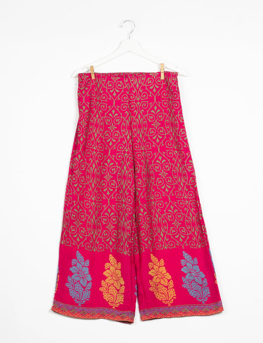 Step into sustainable fashion with our Palazzo Pants – a harmonious blend of Indian and Italian influences. These wide-legged pants, made from upcycled saris, offer comfort with an all-around elastic waist and a stylish flared leg. Make a statement with eco-friendly, chic palazzo pants that redefine ethical clothing.