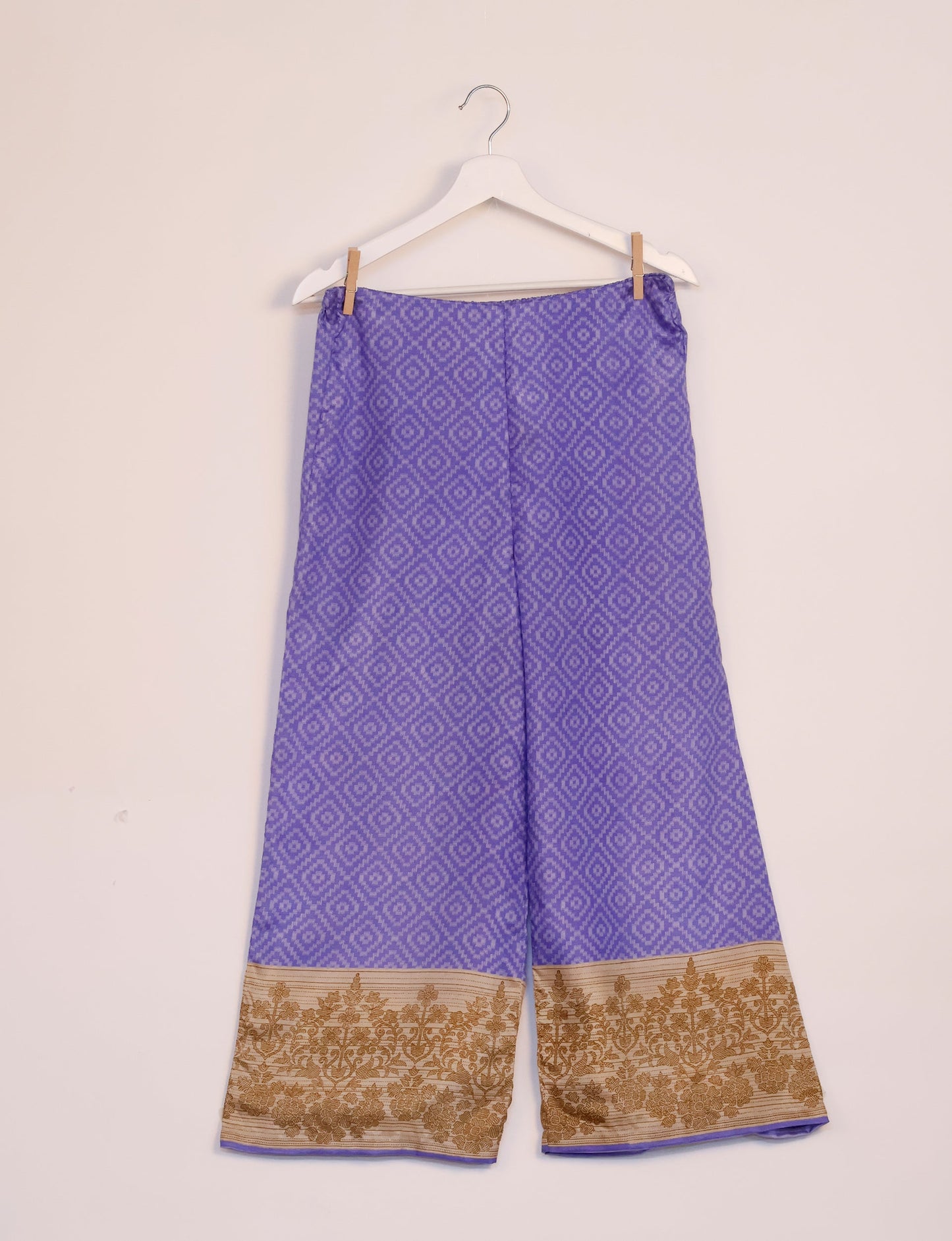 Step into sustainable fashion with our Palazzo Pants – a harmonious blend of Indian and Italian influences. These wide-legged pants, made from upcycled saris, offer comfort with an all-around elastic waist and a stylish flared leg. Make a statement with eco-friendly, chic palazzo pants that redefine ethical clothing.