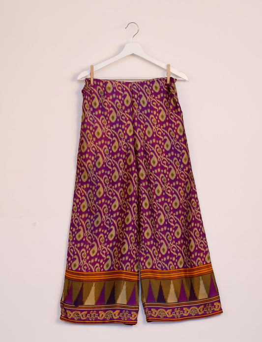 Step into sustainable fashion with our Palazzo Pants – a harmonious blend of Indian and Italian influences. These wide-legged pants, made from upcycled saris, offer comfort with an all-around elastic waist and a stylish flared leg. Make a statement with eco-friendly, chic palazzo pants that redefine ethical clothing.