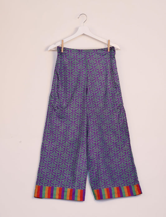 Step into sustainable fashion with our Palazzo Pants – a harmonious blend of Indian and Italian influences. These wide-legged pants, made from upcycled saris, offer comfort with an all-around elastic waist and a stylish flared leg. Make a statement with eco-friendly, chic palazzo pants that redefine ethical clothing.