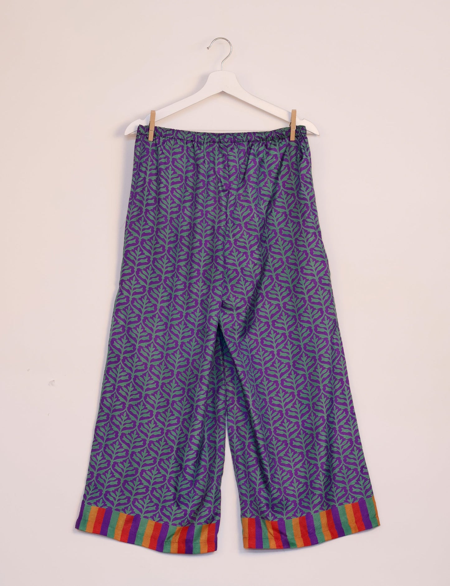 Step into sustainable fashion with our Palazzo Pants – a harmonious blend of Indian and Italian influences. These wide-legged pants, made from upcycled saris, offer comfort with an all-around elastic waist and a stylish flared leg. Make a statement with eco-friendly, chic palazzo pants that redefine ethical clothing.