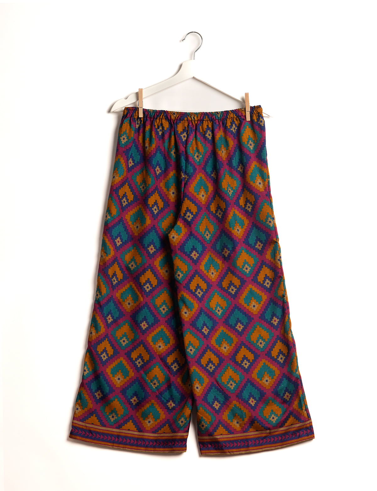 Step into sustainable fashion with our Palazzo Pants – a harmonious blend of Indian and Italian influences. These wide-legged pants, made from upcycled saris, offer comfort with an all-around elastic waist and a stylish flared leg. Make a statement with eco-friendly, chic palazzo pants that redefine ethical clothing.