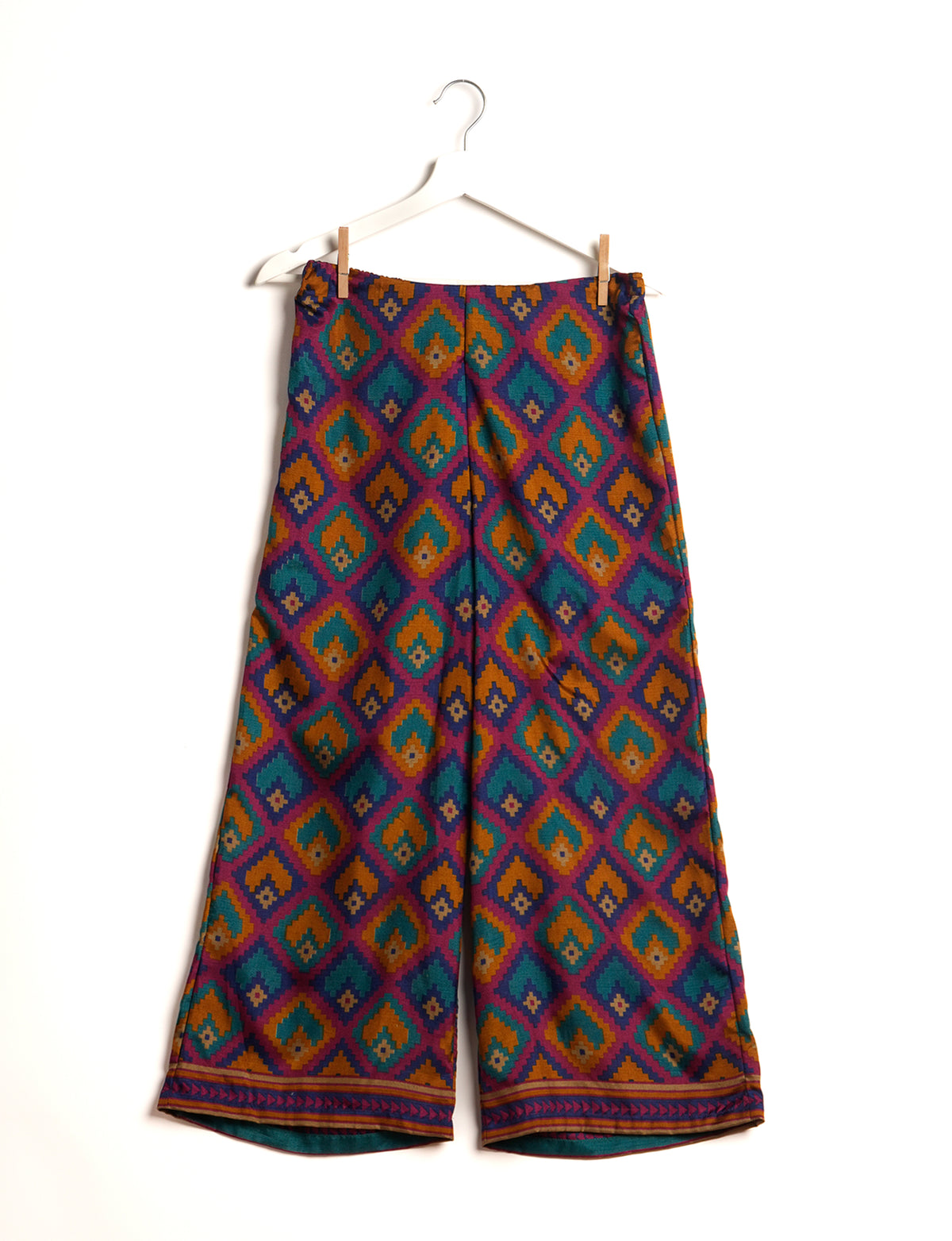 Step into sustainable fashion with our Palazzo Pants – a harmonious blend of Indian and Italian influences. These wide-legged pants, made from upcycled saris, offer comfort with an all-around elastic waist and a stylish flared leg. Make a statement with eco-friendly, chic palazzo pants that redefine ethical clothing.