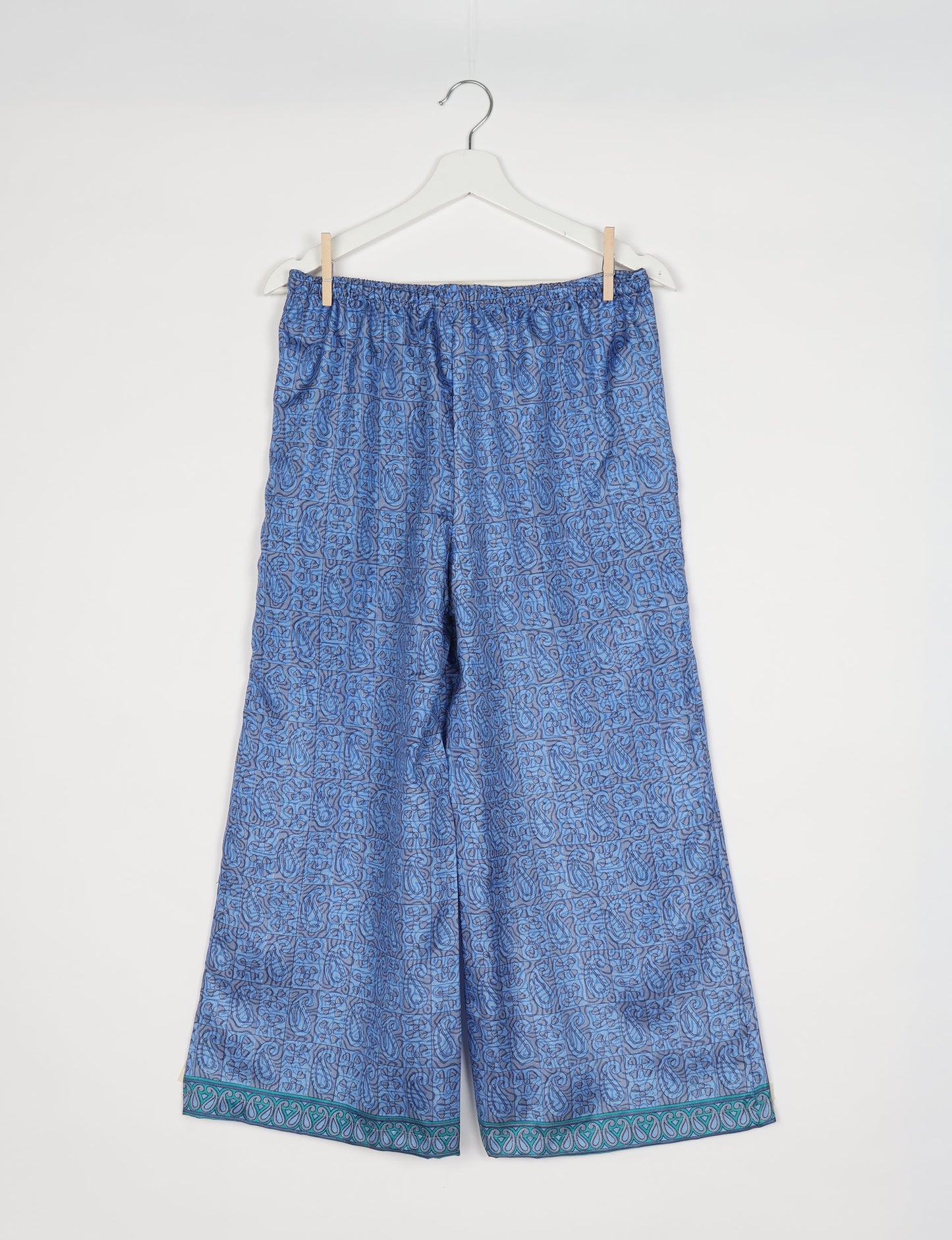 Step into sustainable fashion with our Palazzo Pants – a harmonious blend of Indian and Italian influences. These wide-legged pants, made from upcycled saris, offer comfort with an all-around elastic waist and a stylish flared leg. Make a statement with eco-friendly, chic palazzo pants that redefine ethical clothing.