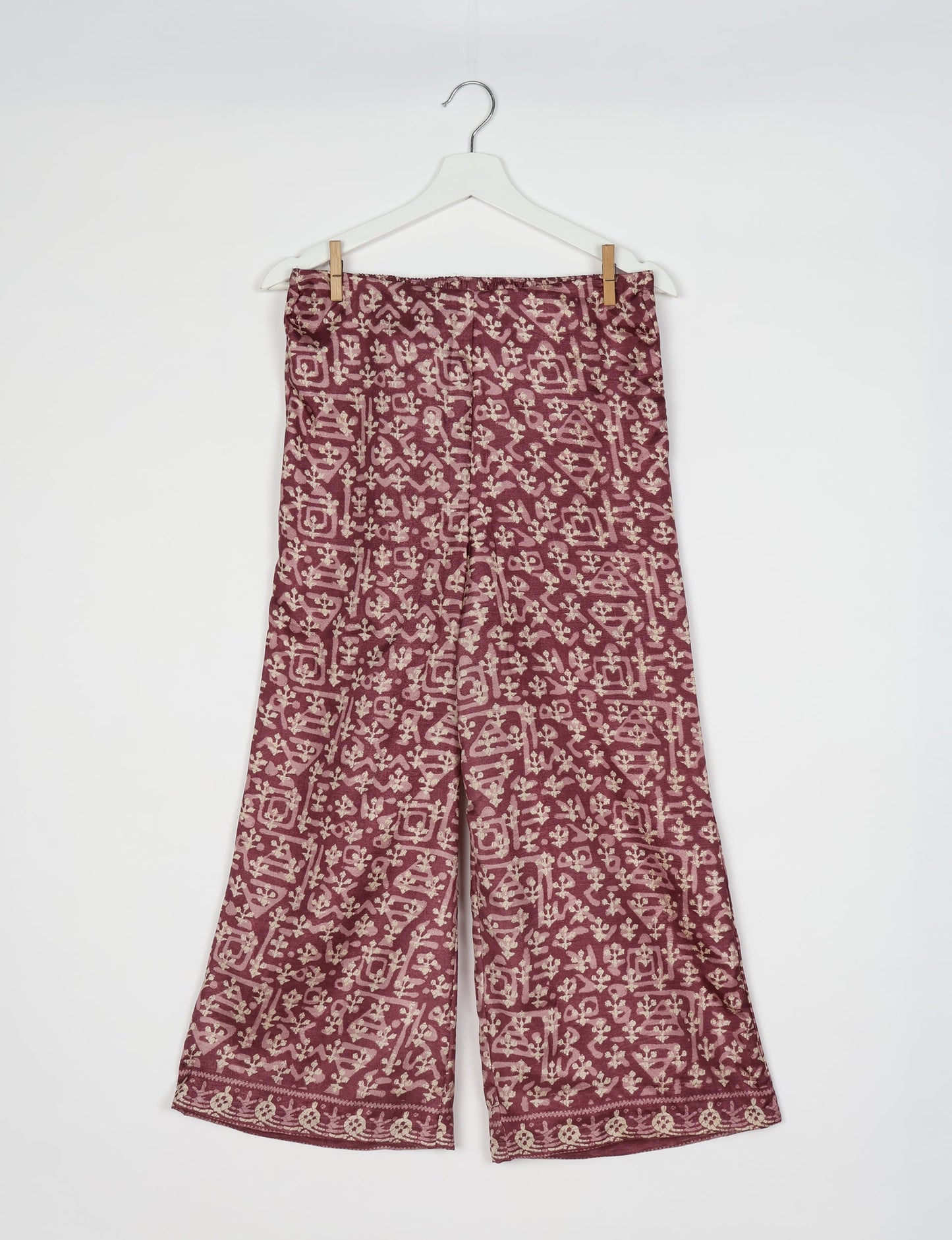 Step into sustainable fashion with our Palazzo Pants – a harmonious blend of Indian and Italian influences. These wide-legged pants, made from upcycled saris, offer comfort with an all-around elastic waist and a stylish flared leg. Make a statement with eco-friendly, chic palazzo pants that redefine ethical clothing.