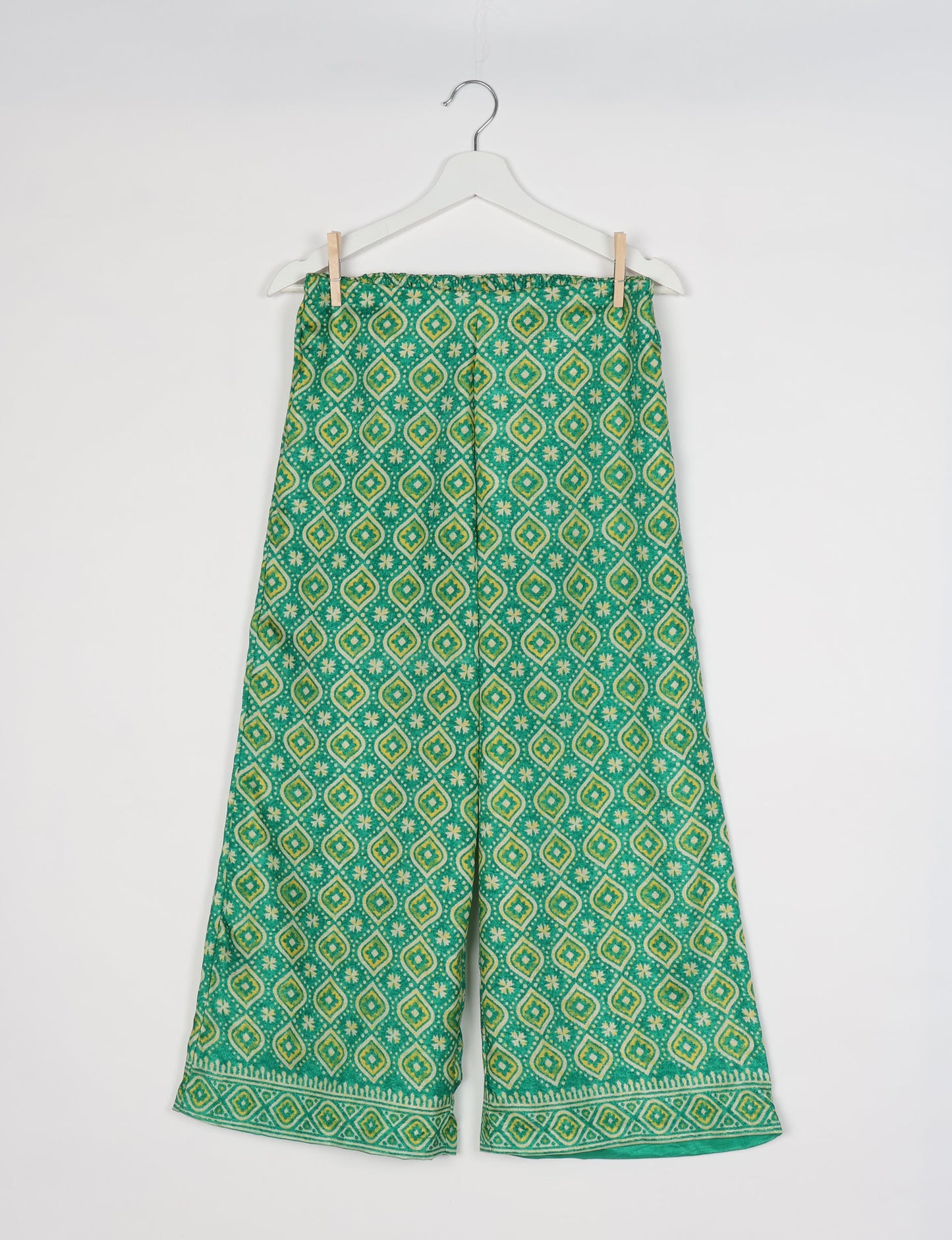 Step into sustainable fashion with our Palazzo Pants – a harmonious blend of Indian and Italian influences. These wide-legged pants, made from upcycled saris, offer comfort with an all-around elastic waist and a stylish flared leg. Make a statement with eco-friendly, chic palazzo pants that redefine ethical clothing.