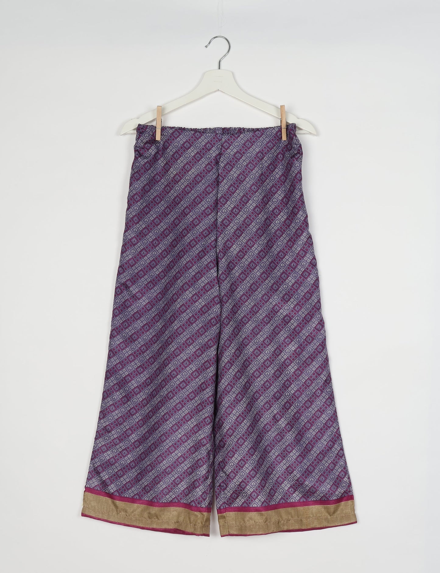 Step into sustainable fashion with our Palazzo Pants – a harmonious blend of Indian and Italian influences. These wide-legged pants, made from upcycled saris, offer comfort with an all-around elastic waist and a stylish flared leg. Make a statement with eco-friendly, chic palazzo pants that redefine ethical clothing.