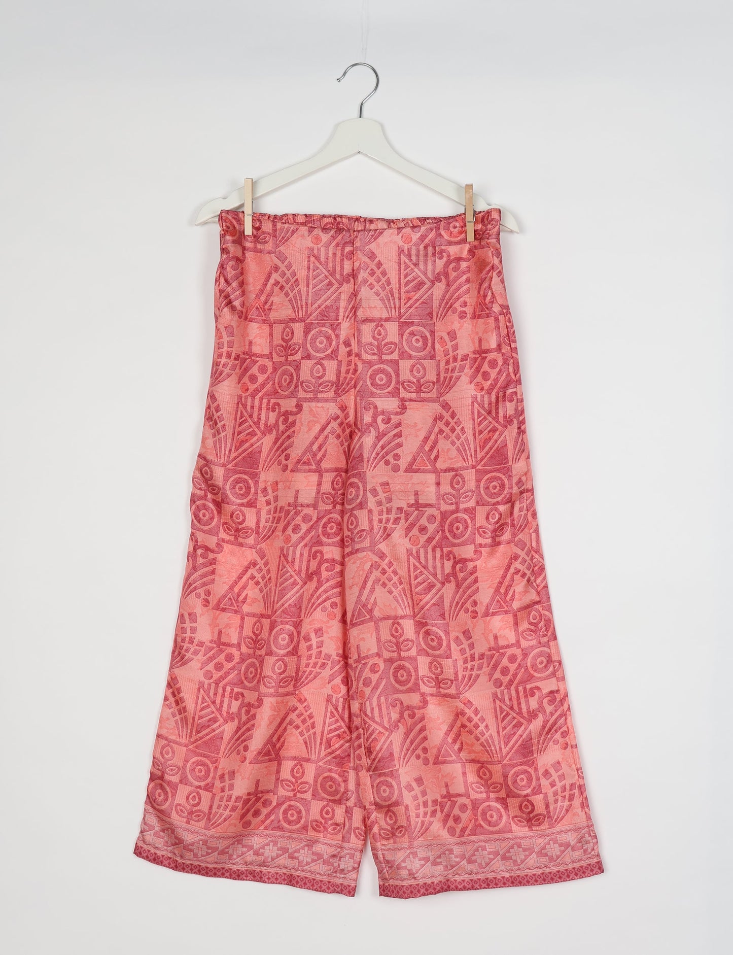 Step into sustainable fashion with our Palazzo Pants – a harmonious blend of Indian and Italian influences. These wide-legged pants, made from upcycled saris, offer comfort with an all-around elastic waist and a stylish flared leg. Make a statement with eco-friendly, chic palazzo pants that redefine ethical clothing.