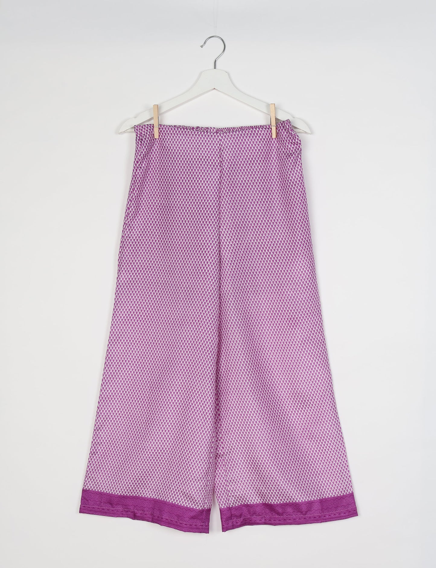 Step into sustainable fashion with our Palazzo Pants – a harmonious blend of Indian and Italian influences. These wide-legged pants, made from upcycled saris, offer comfort with an all-around elastic waist and a stylish flared leg. Make a statement with eco-friendly, chic palazzo pants that redefine ethical clothing.