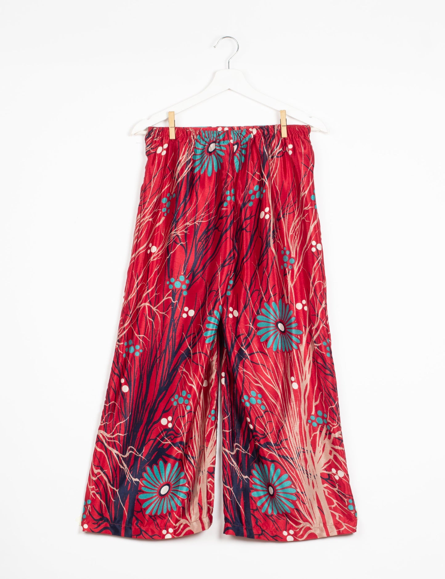 Step into sustainable fashion with our Palazzo Pants – a harmonious blend of Indian and Italian influences. These wide-legged pants, made from upcycled saris, offer comfort with an all-around elastic waist and a stylish flared leg. Make a statement with eco-friendly, chic palazzo pants that redefine ethical clothing.