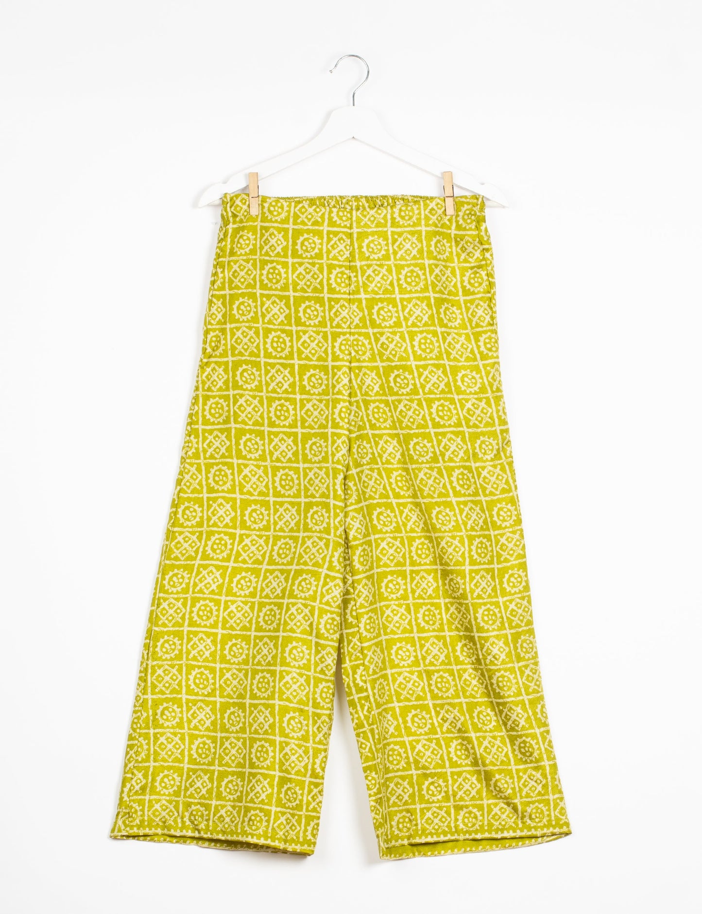 Step into sustainable fashion with our Palazzo Pants – a harmonious blend of Indian and Italian influences. These wide-legged pants, made from upcycled saris, offer comfort with an all-around elastic waist and a stylish flared leg. Make a statement with eco-friendly, chic palazzo pants that redefine ethical clothing.