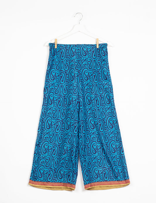 Step into sustainable fashion with our Palazzo Pants – a harmonious blend of Indian and Italian influences. These wide-legged pants, made from upcycled saris, offer comfort with an all-around elastic waist and a stylish flared leg. Make a statement with eco-friendly, chic palazzo pants that redefine ethical clothing.