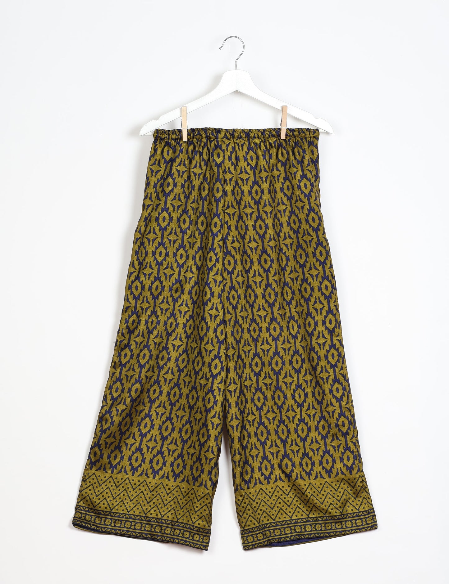 Step into sustainable fashion with our Palazzo Pants – a harmonious blend of Indian and Italian influences. These wide-legged pants, made from upcycled saris, offer comfort with an all-around elastic waist and a stylish flared leg. Make a statement with eco-friendly, chic palazzo pants that redefine ethical clothing.