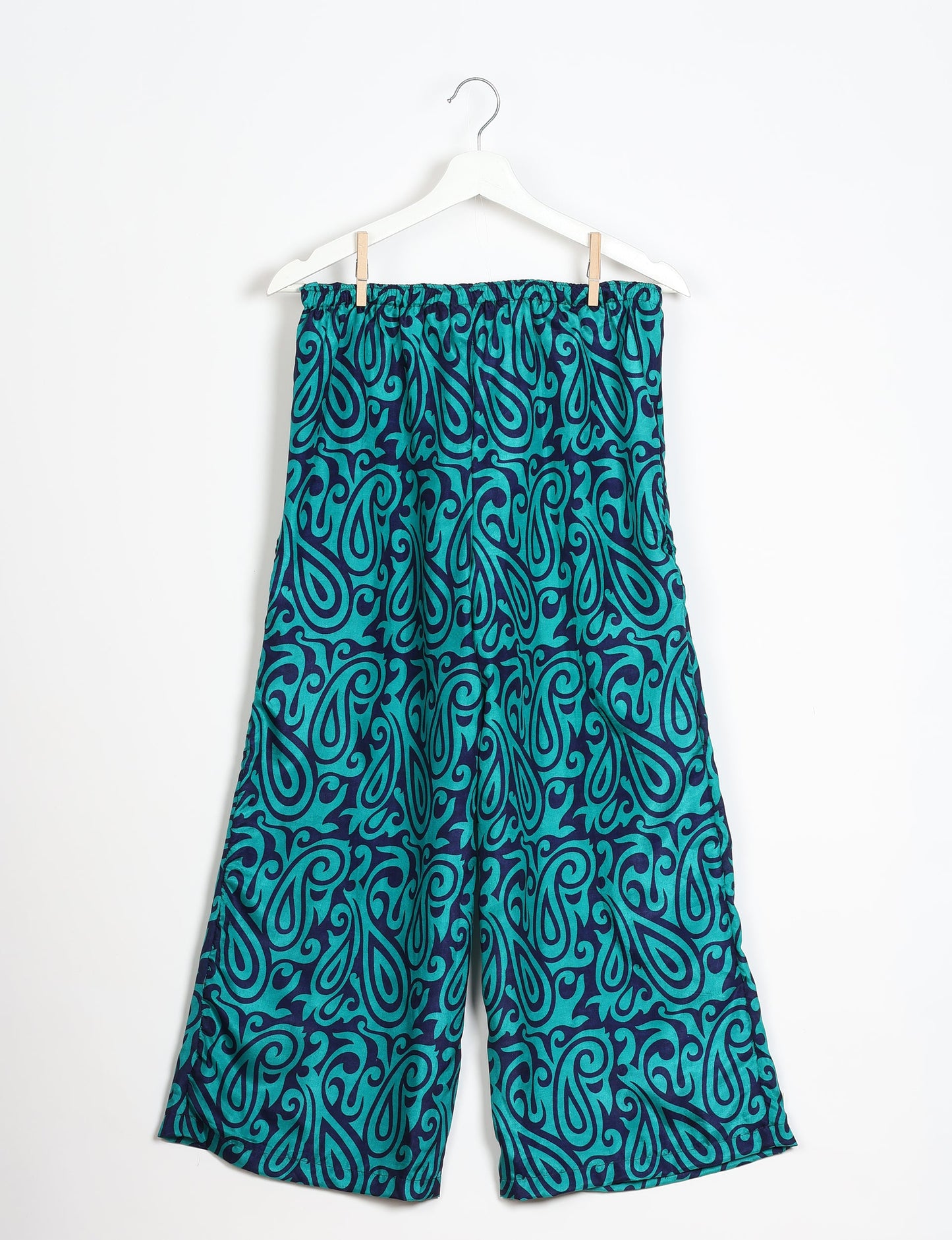 Step into sustainable fashion with our Palazzo Pants – a harmonious blend of Indian and Italian influences. These wide-legged pants, made from upcycled saris, offer comfort with an all-around elastic waist and a stylish flared leg. Make a statement with eco-friendly, chic palazzo pants that redefine ethical clothing.