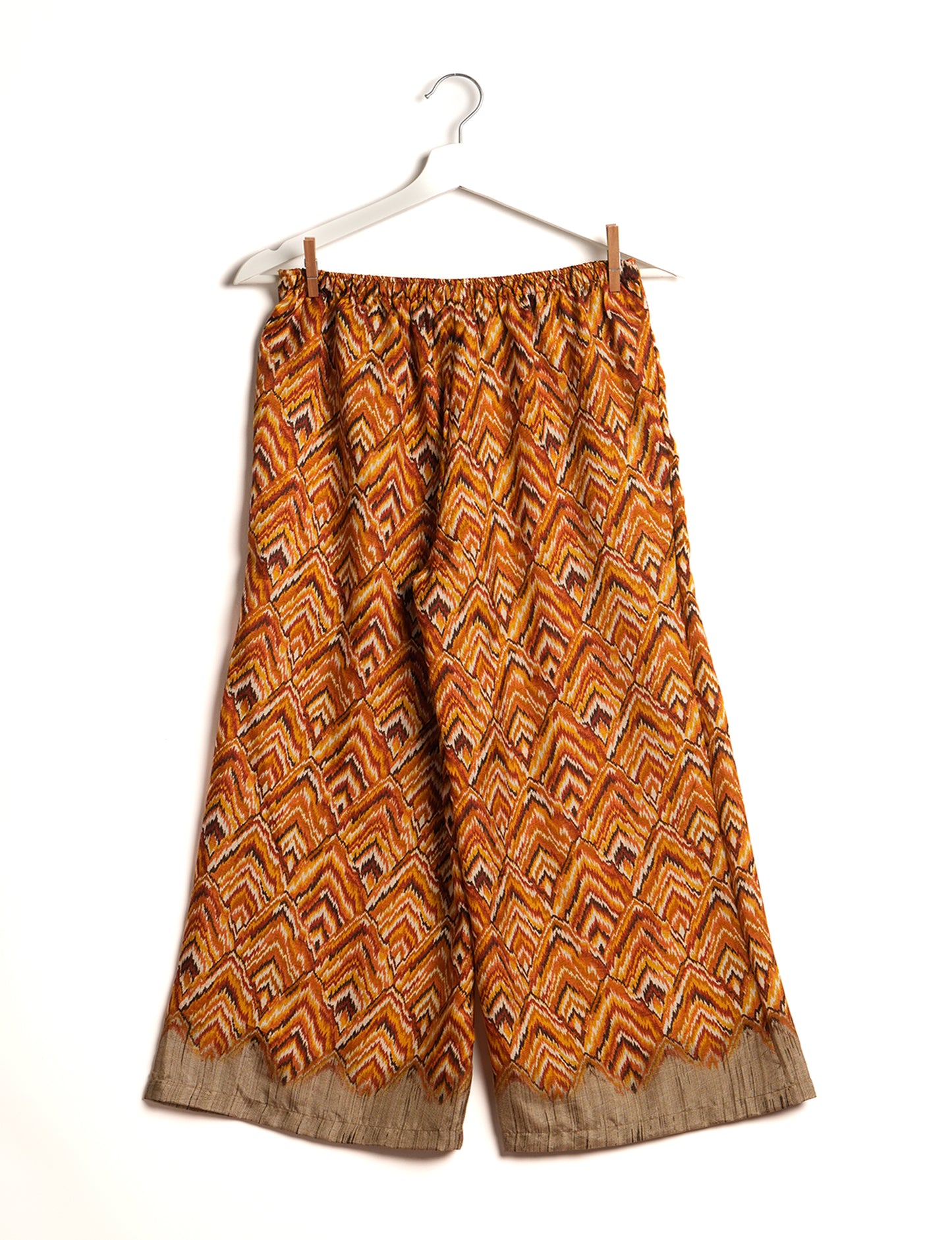 Step into sustainable fashion with our Palazzo Pants – a harmonious blend of Indian and Italian influences. These wide-legged pants, made from upcycled saris, offer comfort with an all-around elastic waist and a stylish flared leg. Make a statement with eco-friendly, chic palazzo pants that redefine ethical clothing.