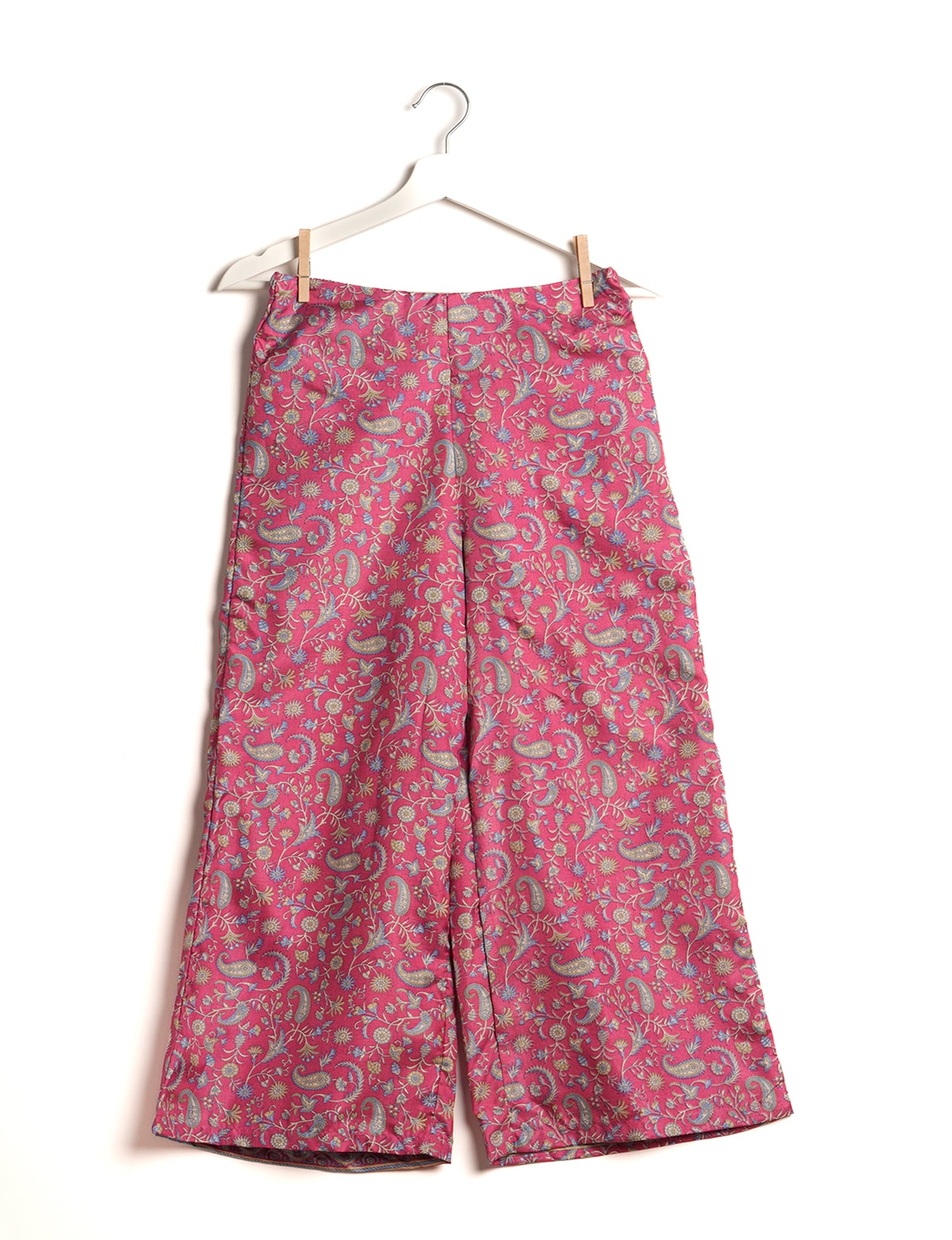 Step into sustainable fashion with our Palazzo Pants – a harmonious blend of Indian and Italian influences. These wide-legged pants, made from upcycled saris, offer comfort with an all-around elastic waist and a stylish flared leg. Make a statement with eco-friendly, chic palazzo pants that redefine ethical clothing.