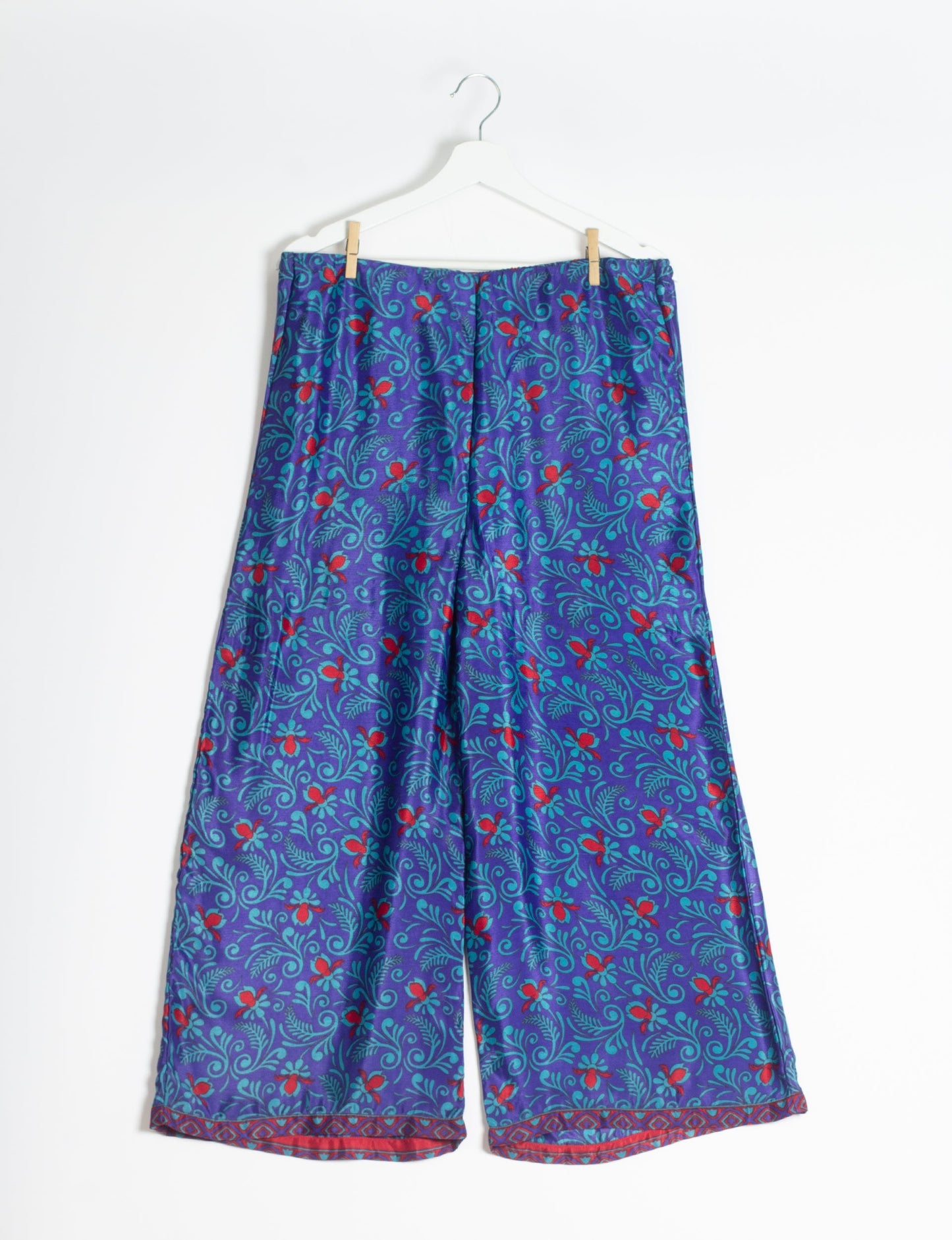 Step into sustainable fashion with our Palazzo Pants – a harmonious blend of Indian and Italian influences. These wide-legged pants, made from upcycled saris, offer comfort with an all-around elastic waist and a stylish flared leg. Make a statement with eco-friendly, chic palazzo pants that redefine ethical clothing.