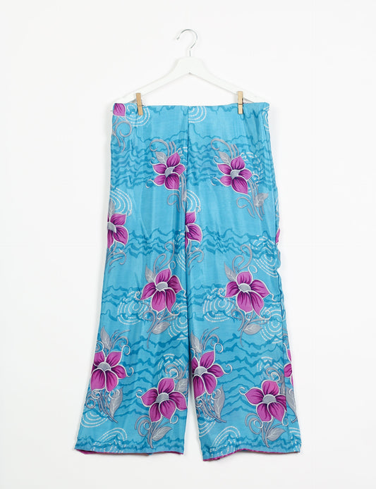 Step into sustainable fashion with our Palazzo Pants – a harmonious blend of Indian and Italian influences. These wide-legged pants, made from upcycled saris, offer comfort with an all-around elastic waist and a stylish flared leg. Make a statement with eco-friendly, chic palazzo pants that redefine ethical clothing.