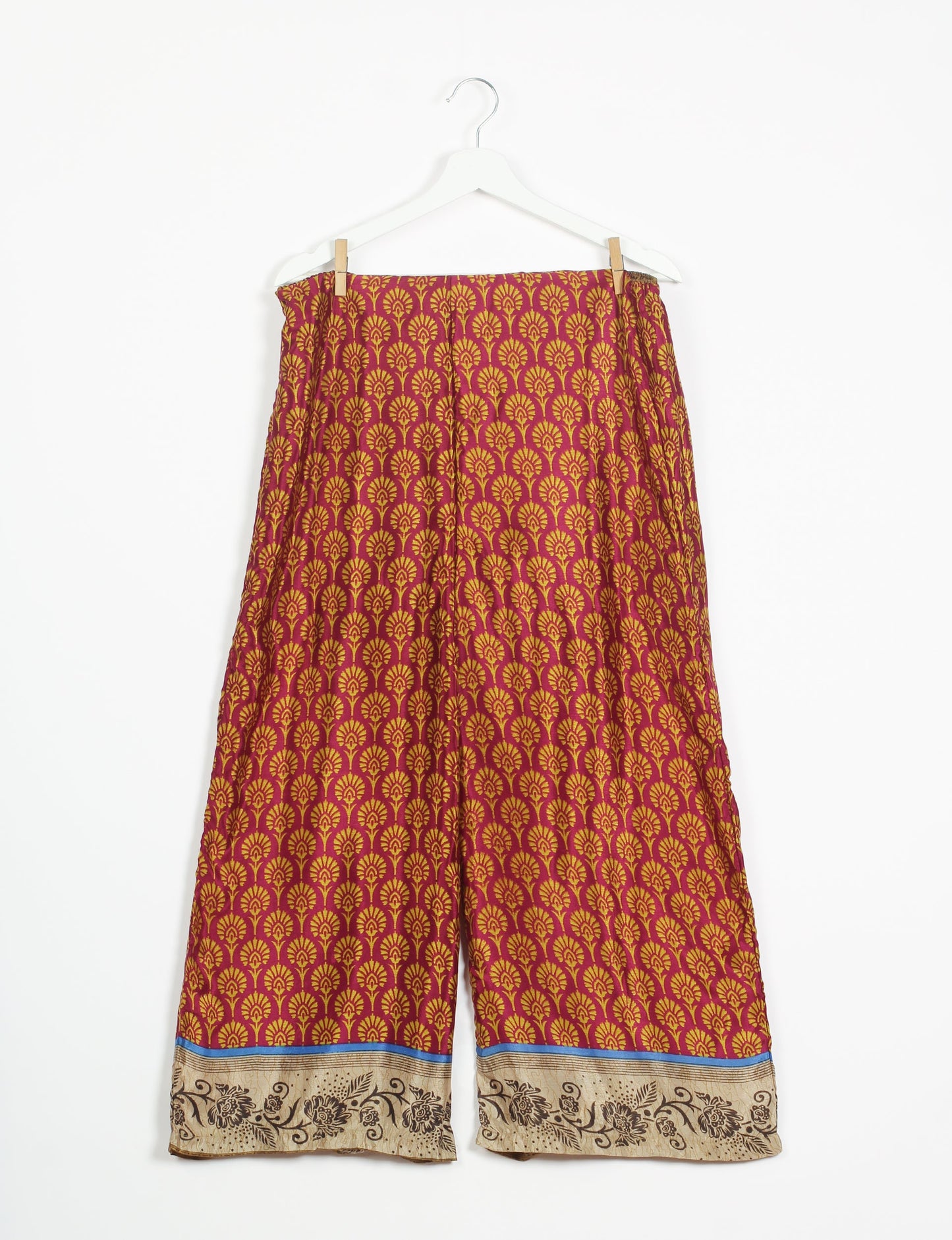 Step into sustainable fashion with our Palazzo Pants – a harmonious blend of Indian and Italian influences. These wide-legged pants, made from upcycled saris, offer comfort with an all-around elastic waist and a stylish flared leg. Make a statement with eco-friendly, chic palazzo pants that redefine ethical clothing.