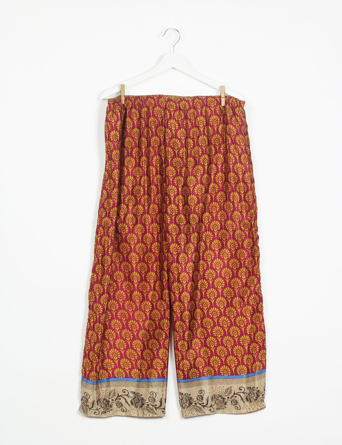 Step into sustainable fashion with our Palazzo Pants – a harmonious blend of Indian and Italian influences. These wide-legged pants, made from upcycled saris, offer comfort with an all-around elastic waist and a stylish flared leg. Make a statement with eco-friendly, chic palazzo pants that redefine ethical clothing.