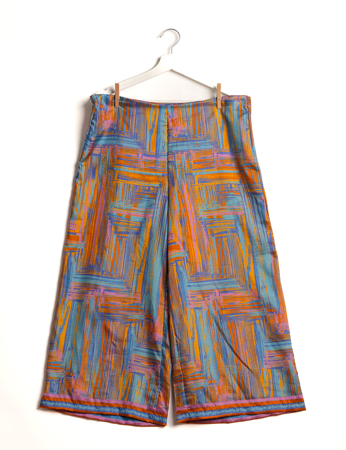 Step into sustainable fashion with our Palazzo Pants – a harmonious blend of Indian and Italian influences. These wide-legged pants, made from upcycled saris, offer comfort with an all-around elastic waist and a stylish flared leg. Make a statement with eco-friendly, chic palazzo pants that redefine ethical clothing.