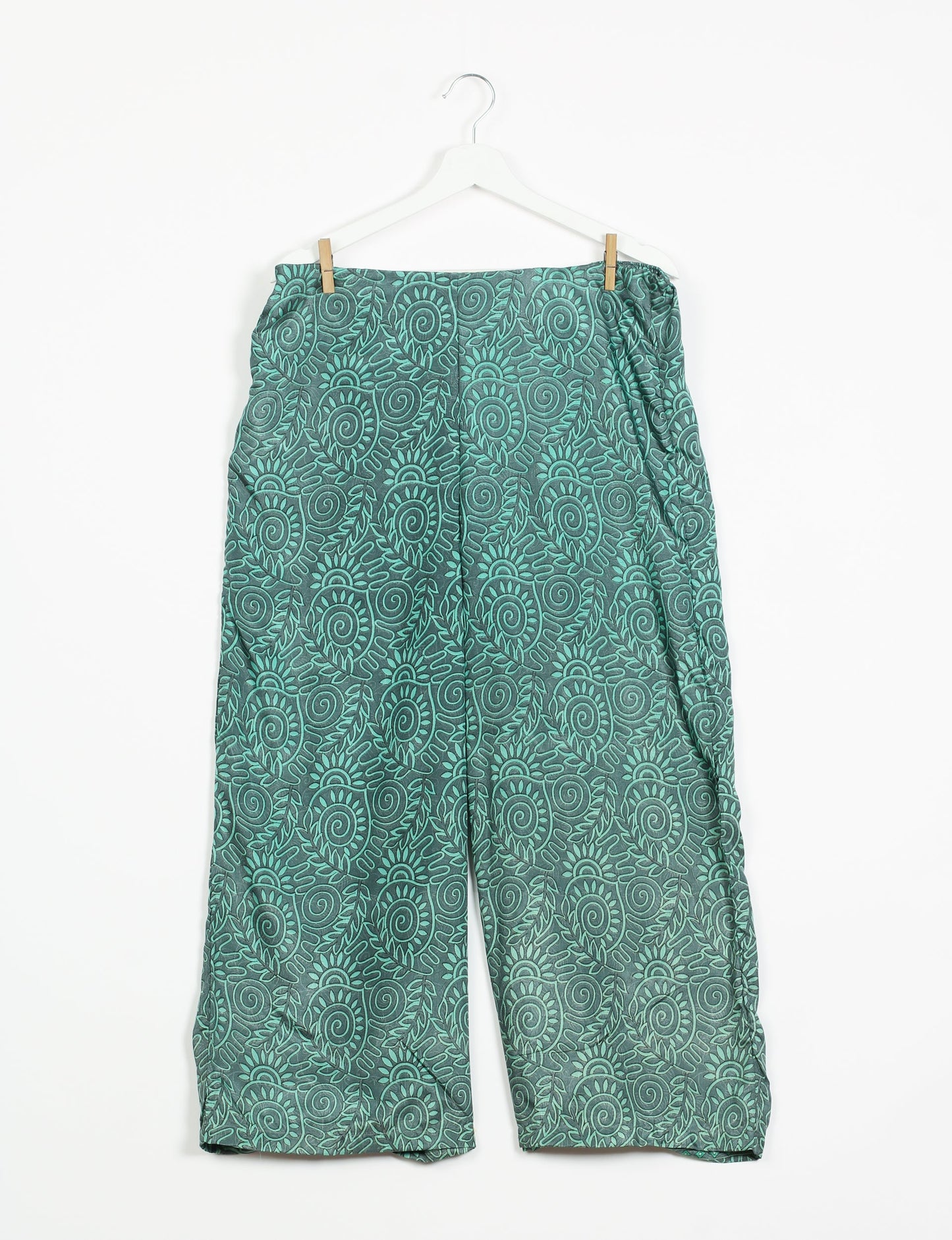 Step into sustainable fashion with our Palazzo Pants – a harmonious blend of Indian and Italian influences. These wide-legged pants, made from upcycled saris, offer comfort with an all-around elastic waist and a stylish flared leg. Make a statement with eco-friendly, chic palazzo pants that redefine ethical clothing.