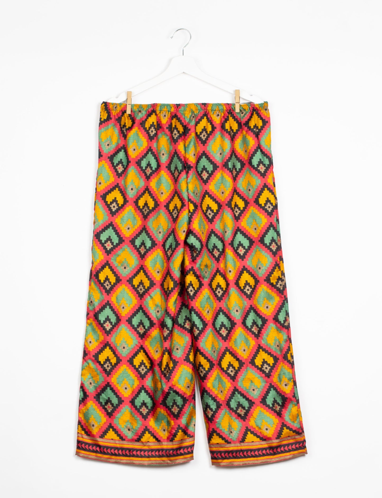 Step into sustainable fashion with our Palazzo Pants – a harmonious blend of Indian and Italian influences. These wide-legged pants, made from upcycled saris, offer comfort with an all-around elastic waist and a stylish flared leg. Make a statement with eco-friendly, chic palazzo pants that redefine ethical clothing.