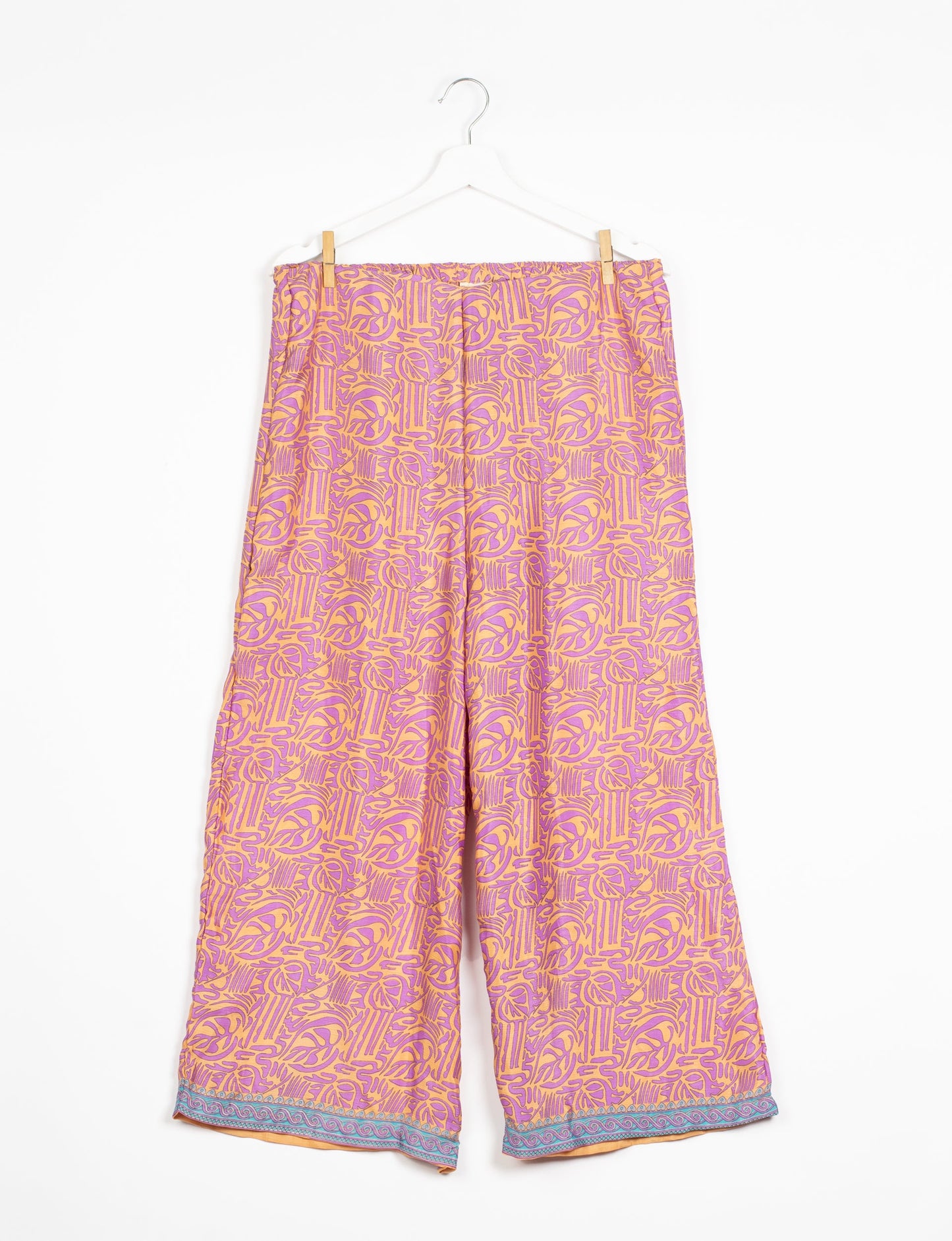 Step into sustainable fashion with our Palazzo Pants – a harmonious blend of Indian and Italian influences. These wide-legged pants, made from upcycled saris, offer comfort with an all-around elastic waist and a stylish flared leg. Make a statement with eco-friendly, chic palazzo pants that redefine ethical clothing.