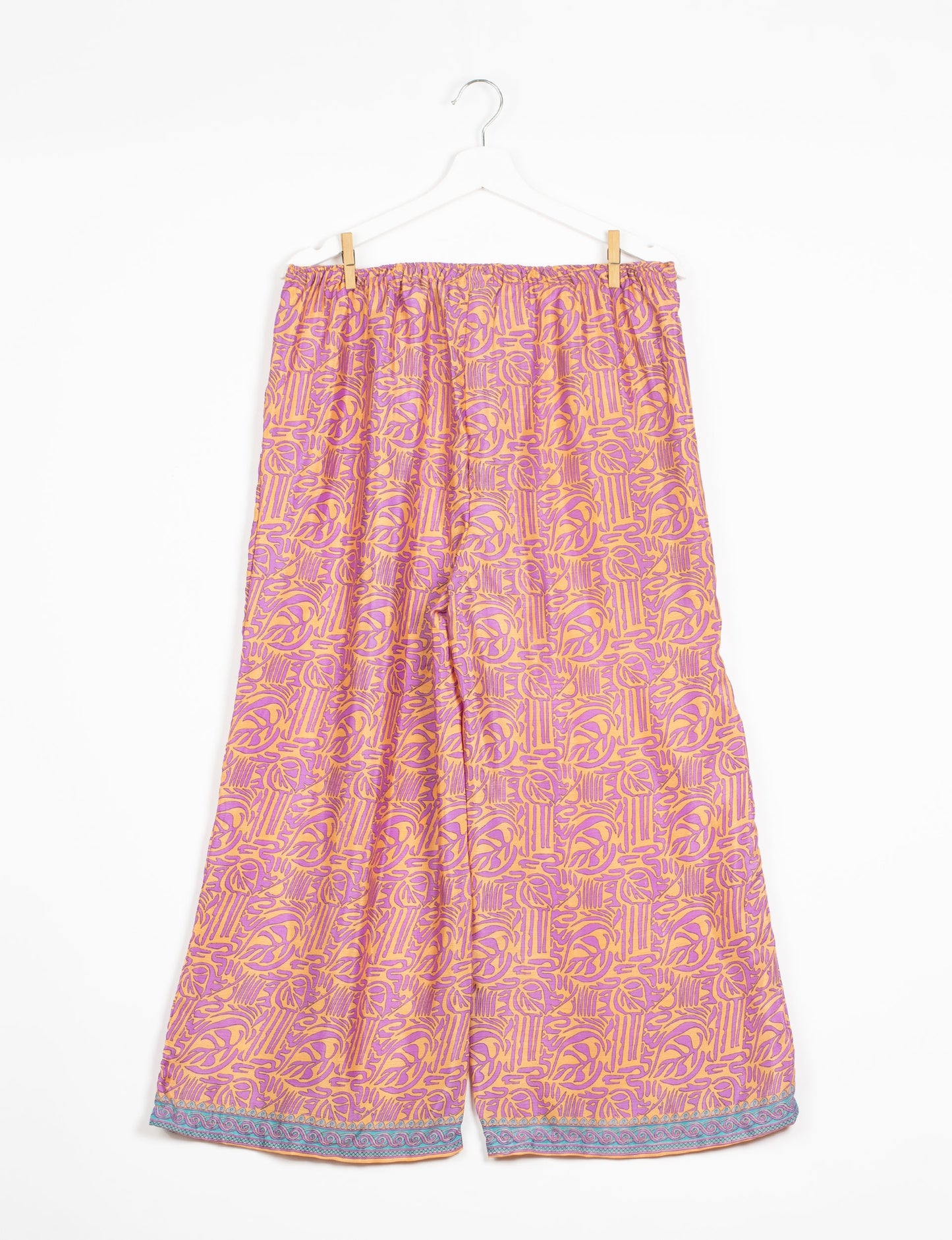 Step into sustainable fashion with our Palazzo Pants – a harmonious blend of Indian and Italian influences. These wide-legged pants, made from upcycled saris, offer comfort with an all-around elastic waist and a stylish flared leg. Make a statement with eco-friendly, chic palazzo pants that redefine ethical clothing.