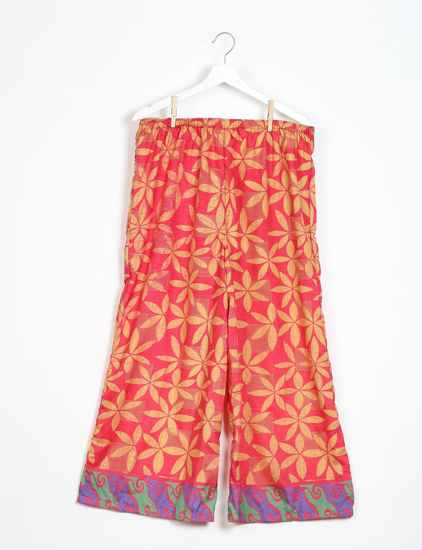 Step into sustainable fashion with our Palazzo Pants – a harmonious blend of Indian and Italian influences. These wide-legged pants, made from upcycled saris, offer comfort with an all-around elastic waist and a stylish flared leg. Make a statement with eco-friendly, chic palazzo pants that redefine ethical clothing.