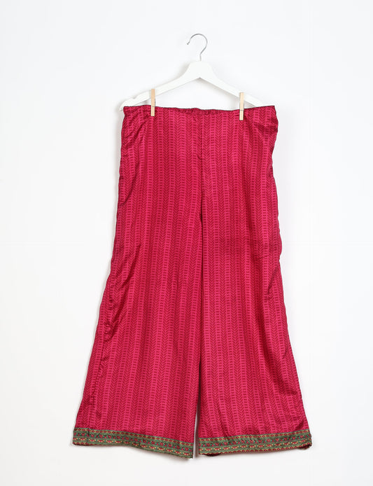 Step into sustainable fashion with our Palazzo Pants – a harmonious blend of Indian and Italian influences. These wide-legged pants, made from upcycled saris, offer comfort with an all-around elastic waist and a stylish flared leg. Make a statement with eco-friendly, chic palazzo pants that redefine ethical clothing.